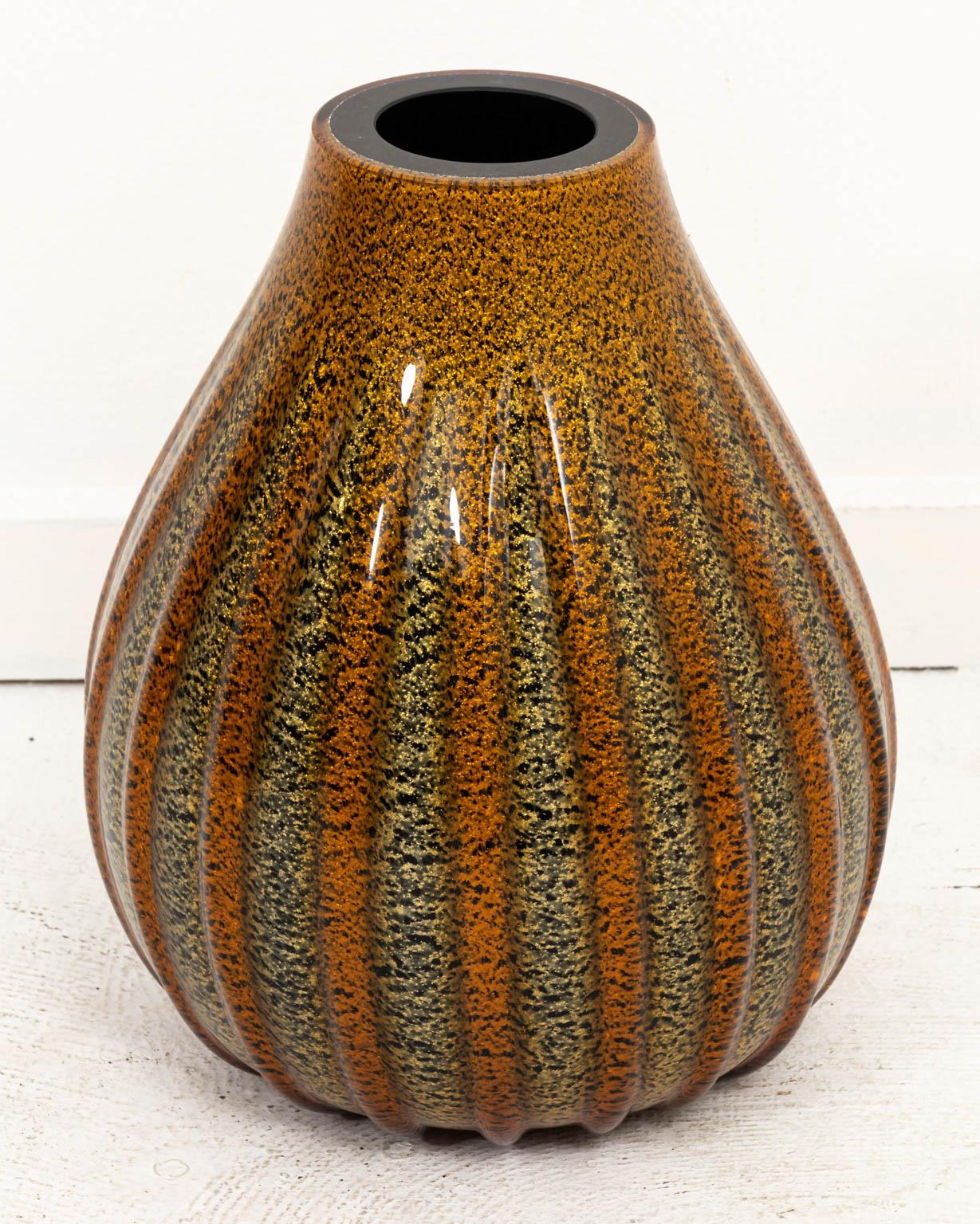 Striped Murano glass vase with alternating bands of orange and dark brown with gold inclusions, circa mid-20th century. There is also a dark brown interior. Retains 