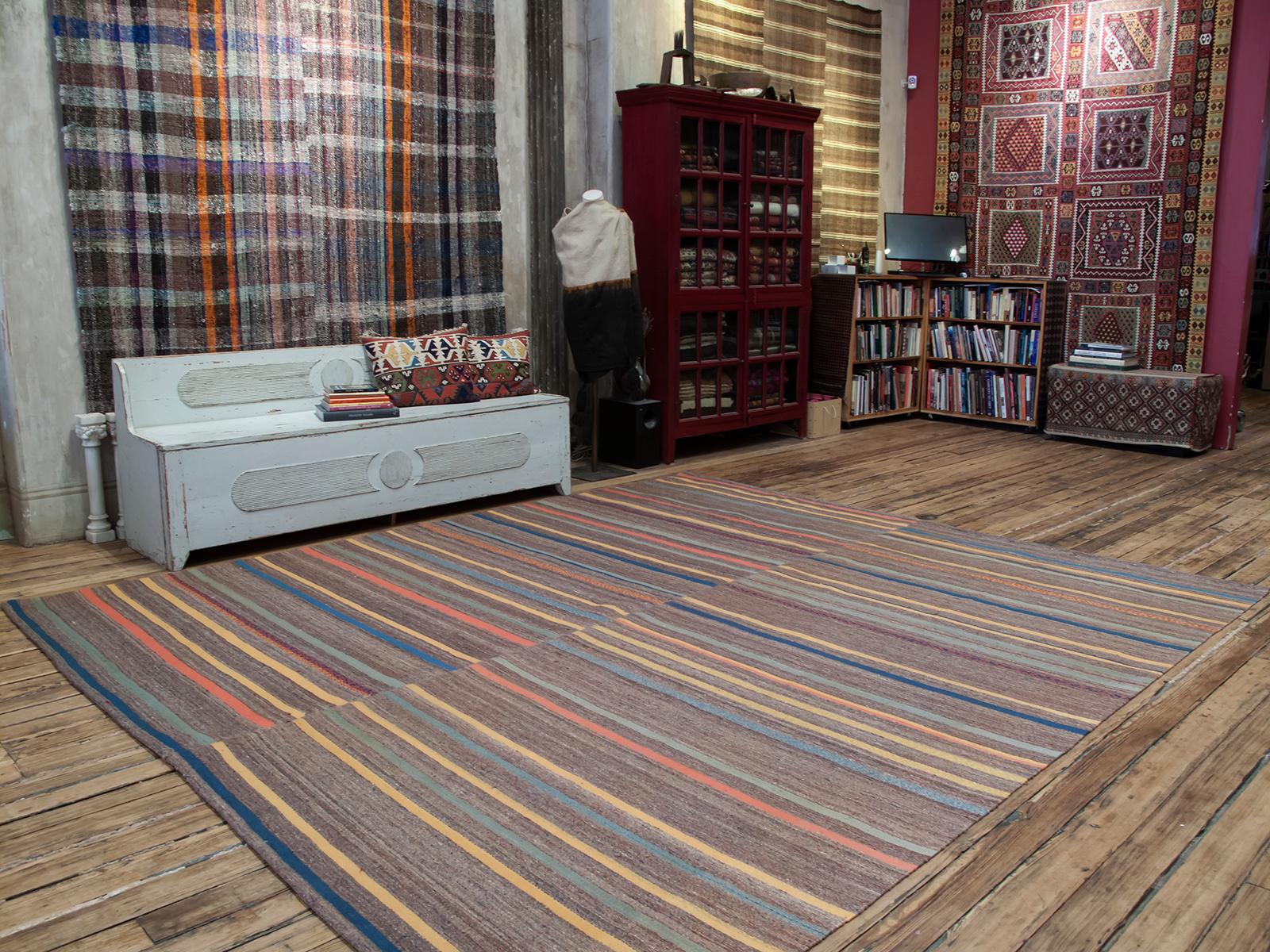 A matching pair of striped kilims from Central Turkey joined to make a large square floor cover.

Very well preserved, sturdy and clean. Size can be adjusted, the panels can be separated. Please inquire.