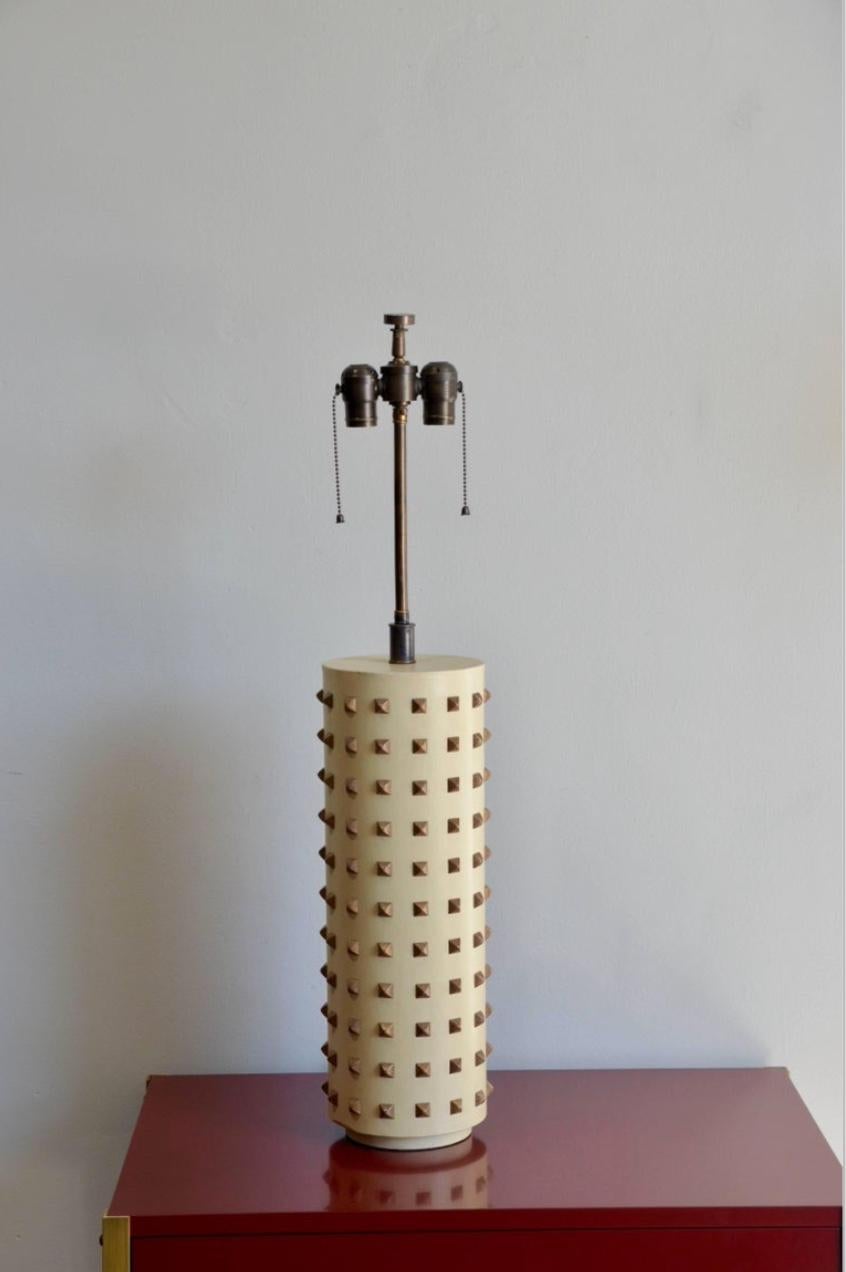 Large studded cylinder table lamp.