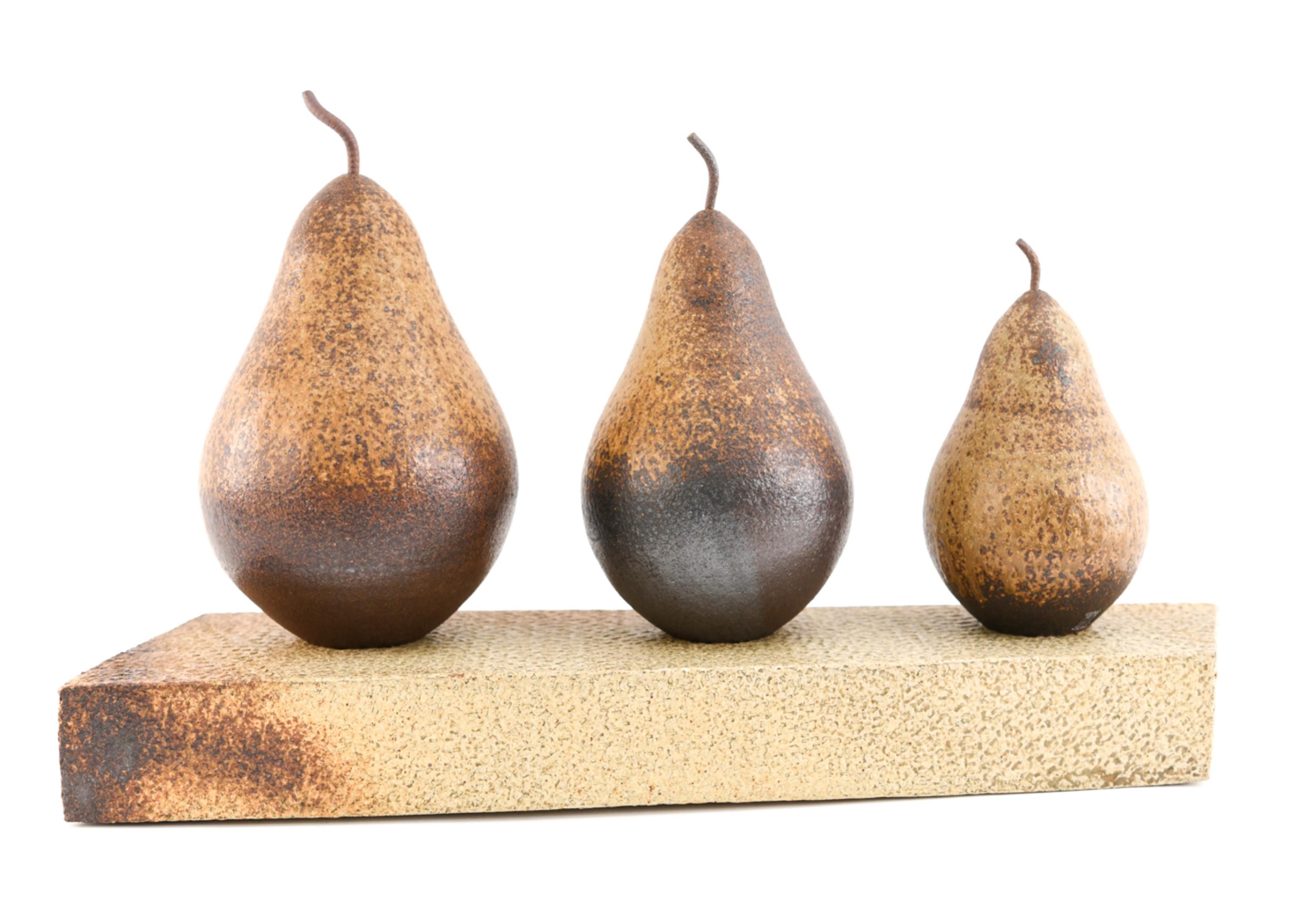 A four piece sculpture consisting of 3 large pears and a platform base. Signed on all pieces.