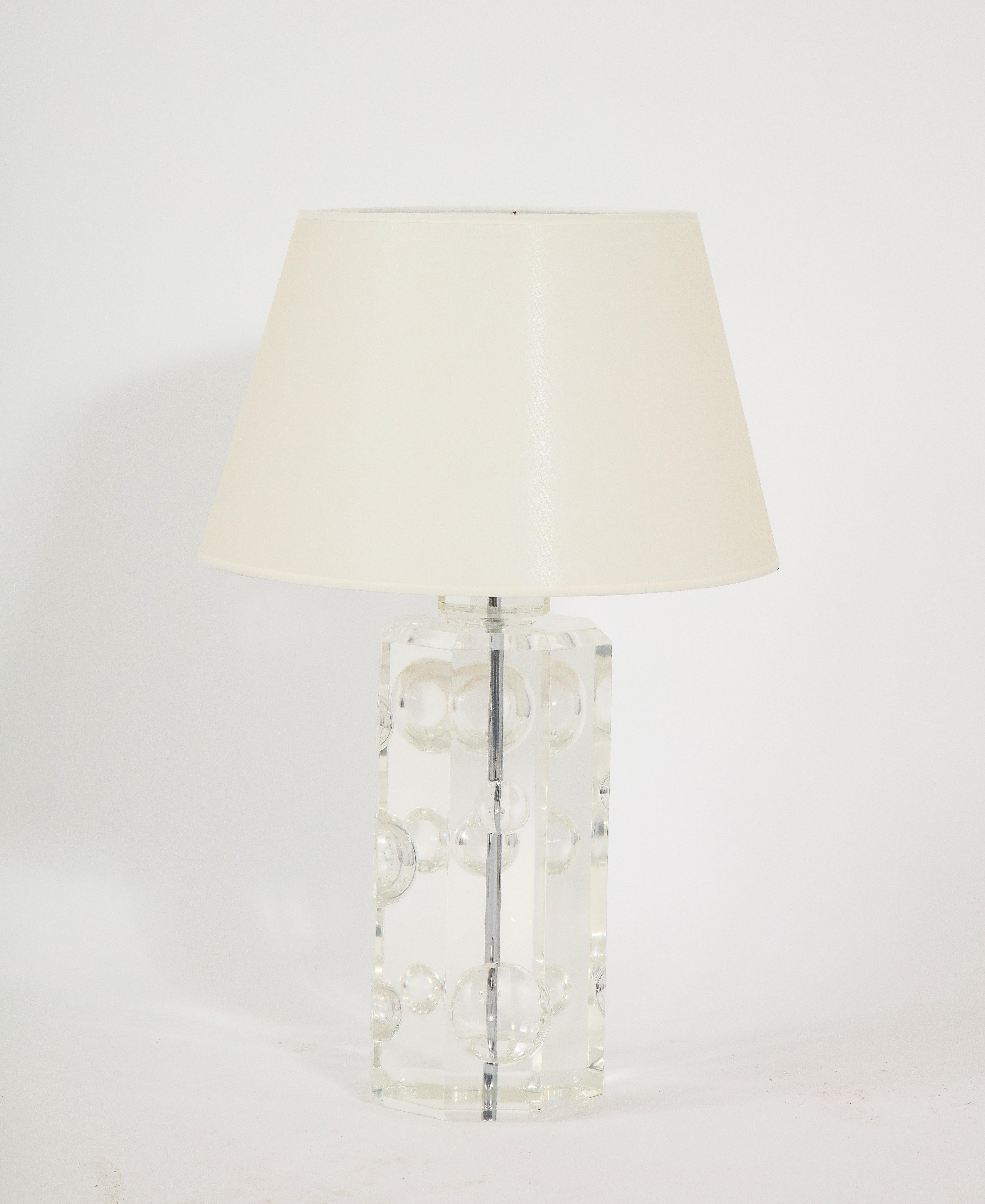 Large and stunning solid lucite lamp with carved motif. Shade is for photo only.
