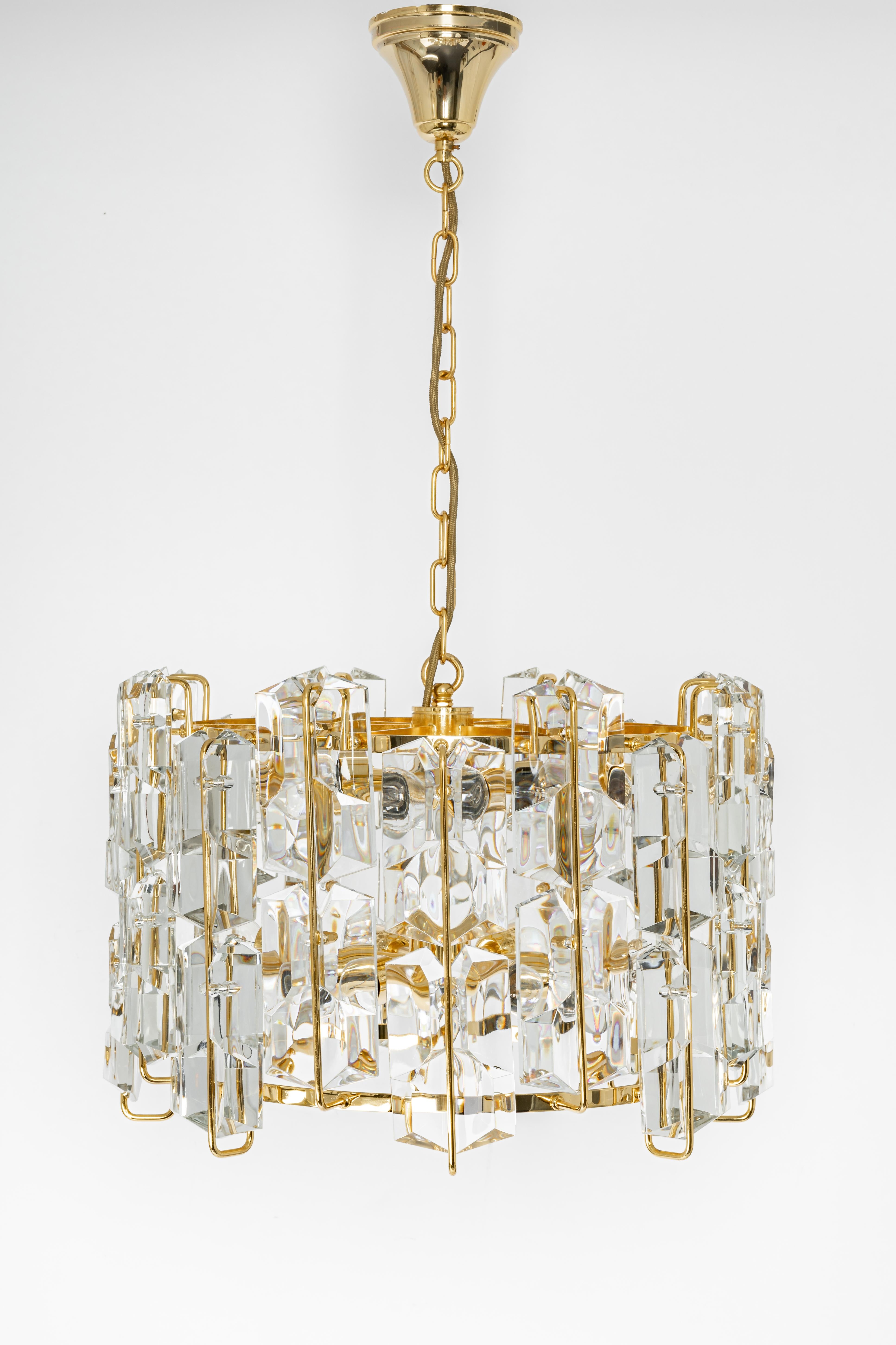 Large stunning chandelier with many crystal glass over a gilt brass frame, made by Ernst Palme in Germany, 1970s.
High quality and in very good condition. Cleaned, well-wired and ready to use. 

The chandelier requires 16 x E14 bulbs ( up to 40 W