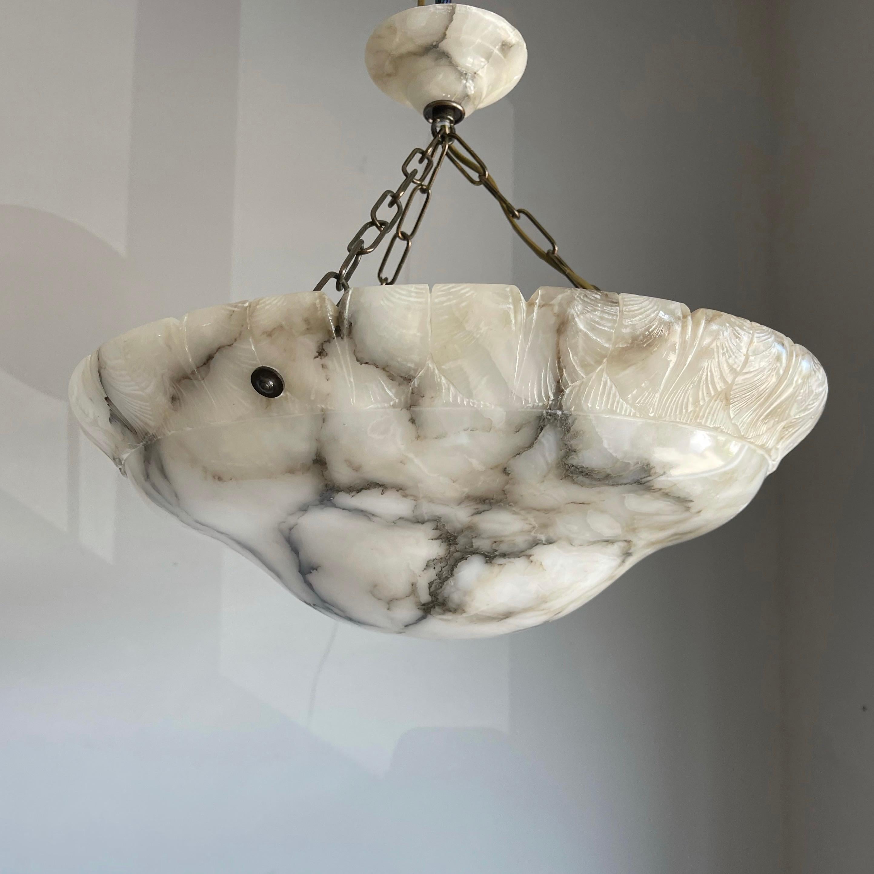Superb condition marble chandelier with a stunning and great size alabaster mineral stone shade.

Thanks to its large size, deep shape and remarkable design this alabaster chandelier will light up both your days and evenings. It is in excellent