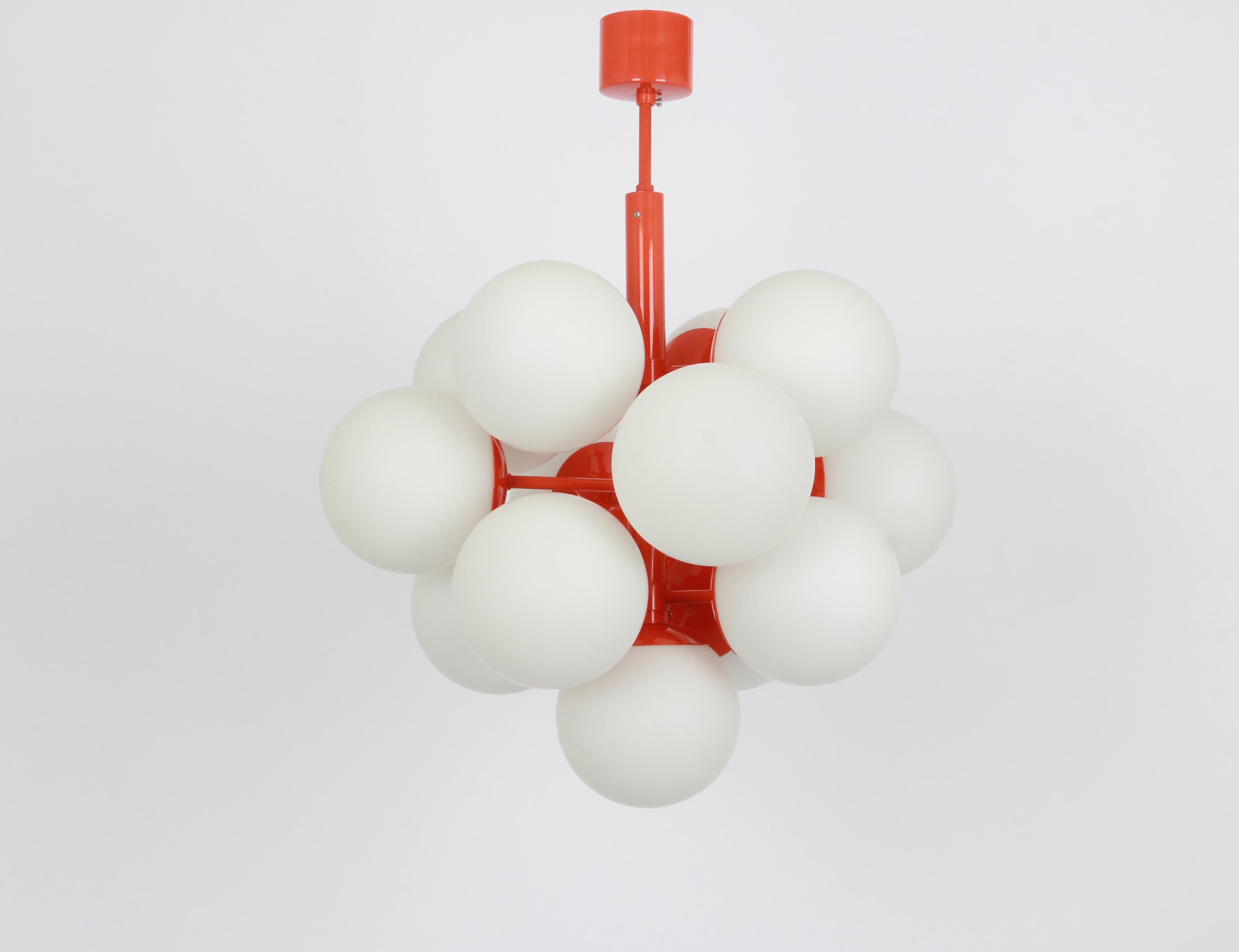 Stunning Orange color Sputnik chandelier with 13 handmade glass globes by Kaiser Leuchten, Germany, 1960s.
High quality and in very good condition. Cleaned, well-wired, and ready to use. 

The fixture requires 13 x E14 small bulbs with 40W max