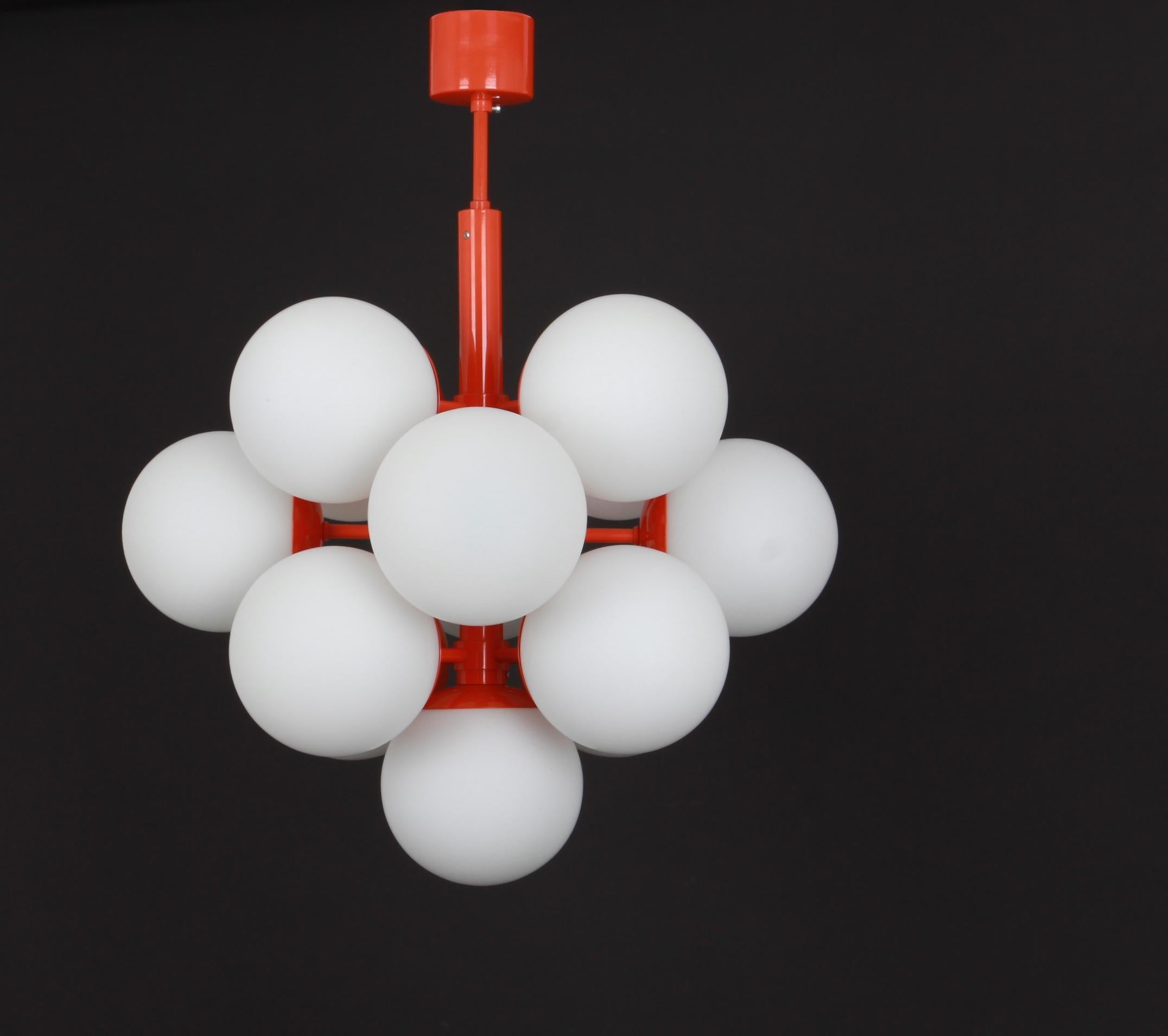Stunning Orange color Sputnik chandelier with 13 handmade glass globes by Kaiser Leuchten, Germany, 1960s.
High quality and in very good condition. Cleaned, well-wired, and ready to use. 

The fixture requires 13 x E14 small bulbs with 40W max