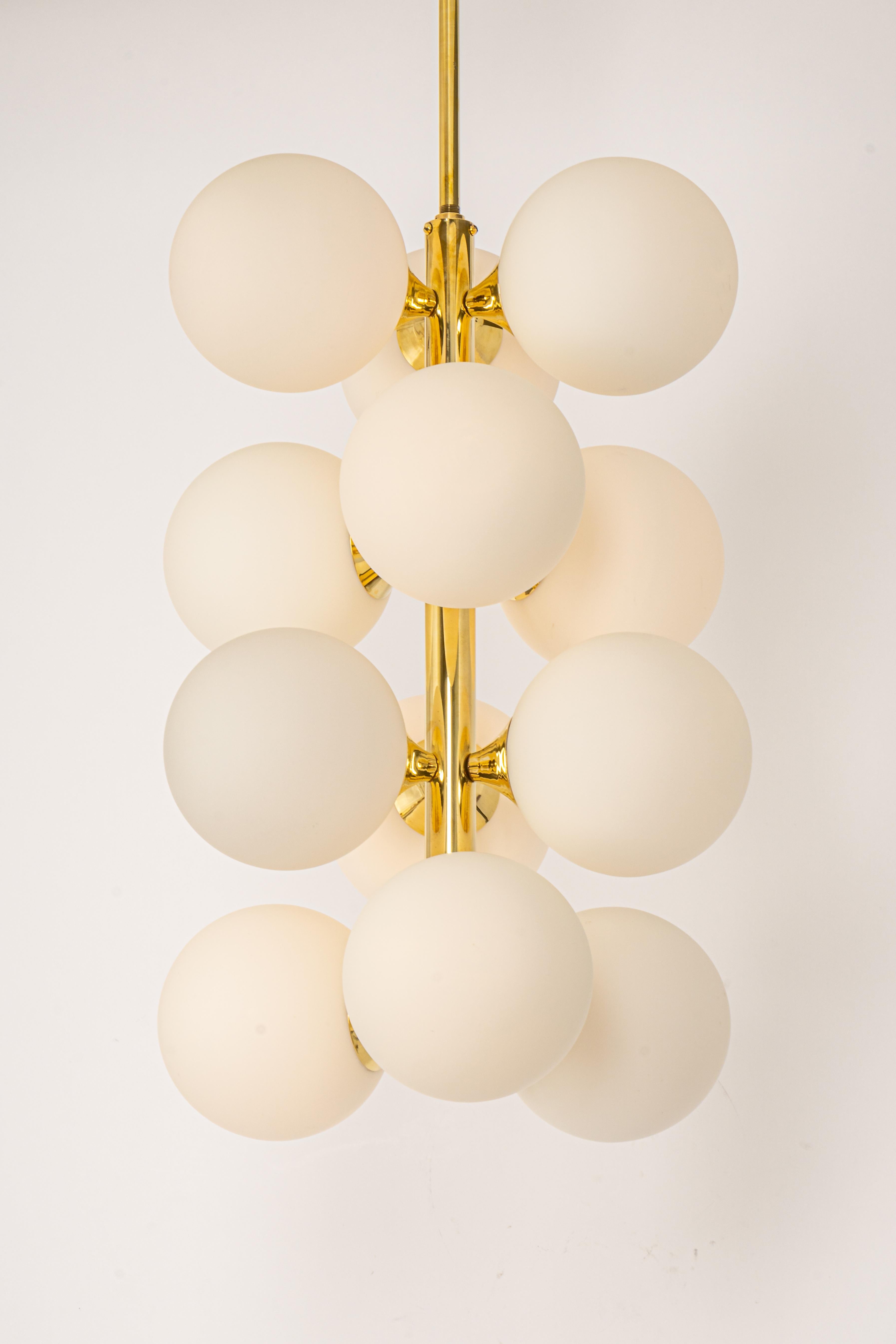 Stunning Sputnik chandelier with 12 handmade glass globes by Kaiser Leuchten, Germany, 1960s.

High quality and in very good condition. Cleaned, well-wired and ready to use. 

The fixture requires 12 x E14 small bulbs with 40W max each and