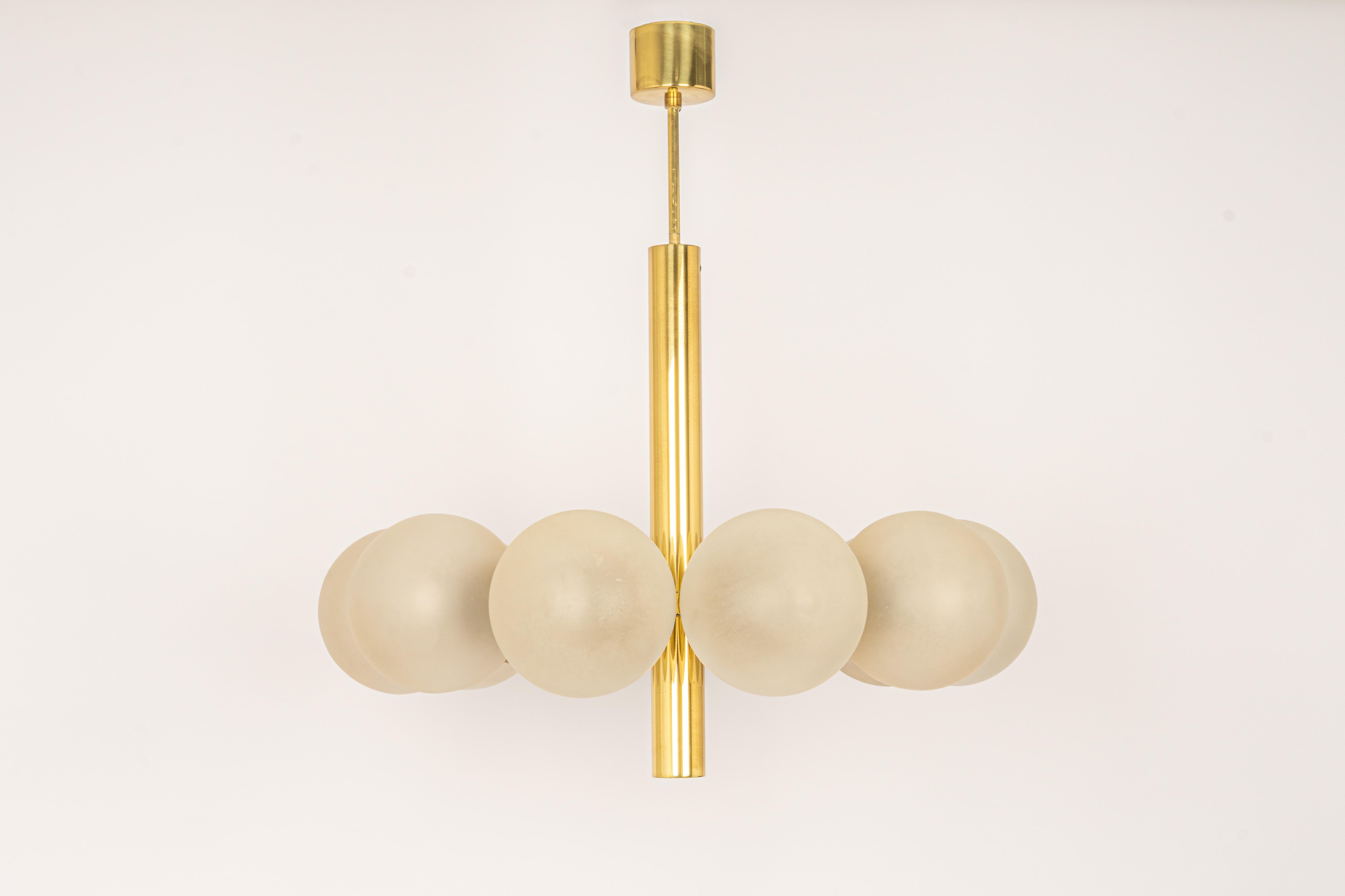 Stunning radial Sputnik brass chandelier with six opal glass globes by Kaiser Leuchten, Germany, 1960s.

High quality and in very good condition. Cleaned, well-wired and ready to use. 

The fixture requires 10 x E14 Standard bulbs with 40W max