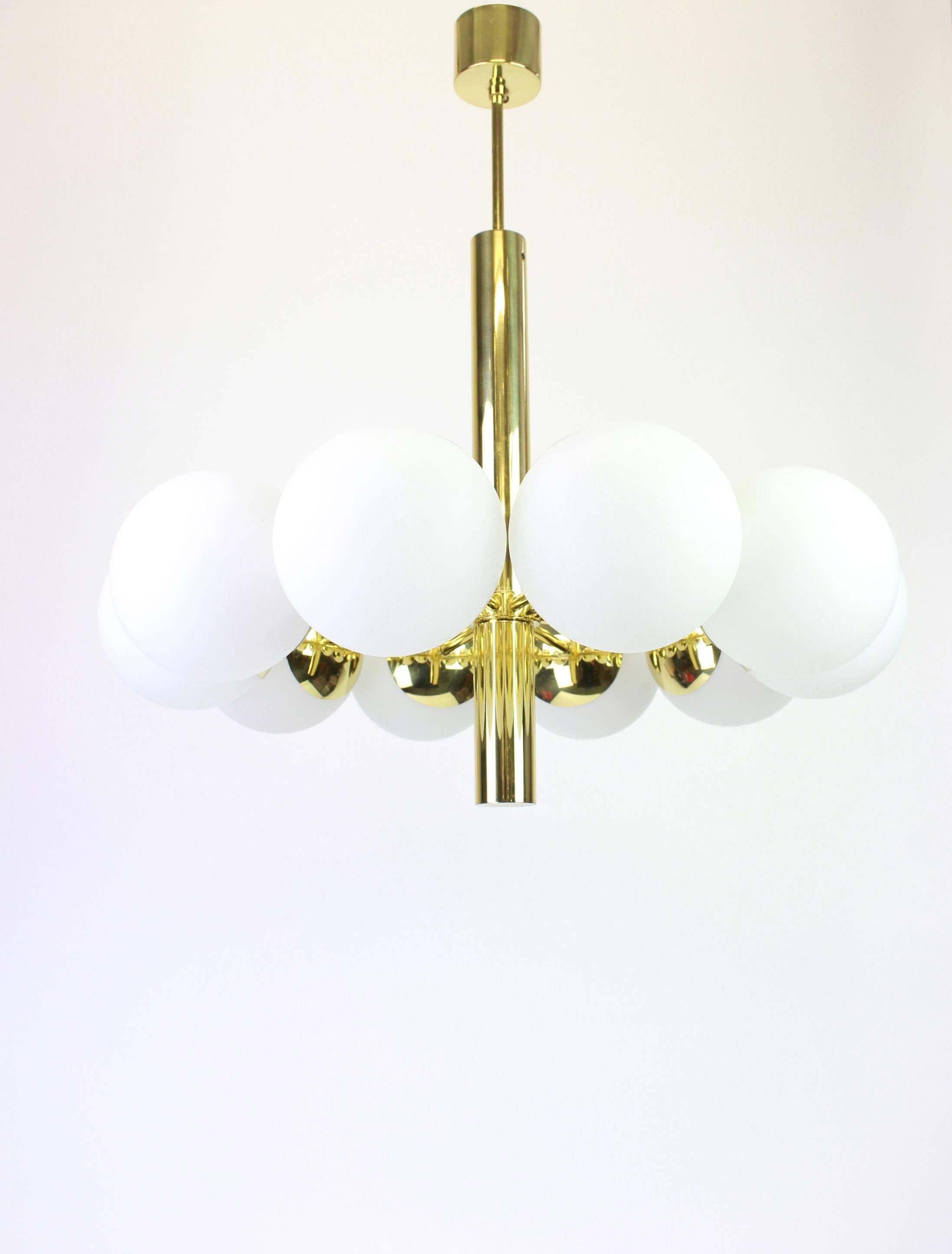 Stunning radial Sputnik brass chandelier with six opal glass globes by Kaiser Leuchten, Germany, 1960s.

High quality and in very good condition. Cleaned, well-wired and ready to use. 

The fixture requires 10 x E14 standard bulbs with 40W max