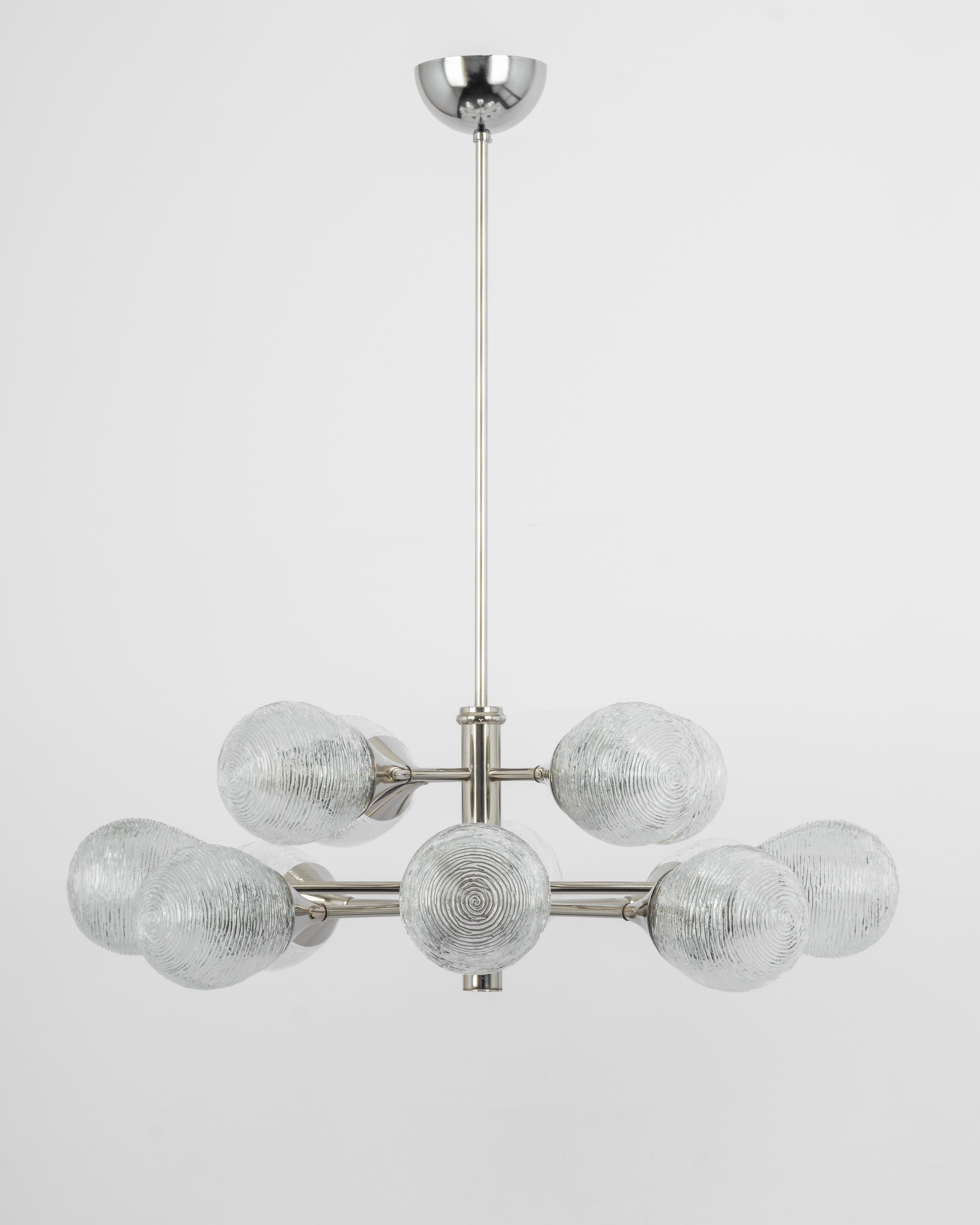 Stunning Sputnik chrome chandelier with 12 glass globes by Kaiser Leuchten, Germany, 1970s.
High quality and in very good condition. Cleaned, well-wired, and ready to use. 

The fixture requires 12 x E14 small bulbs with 40W max each.
Light bulbs