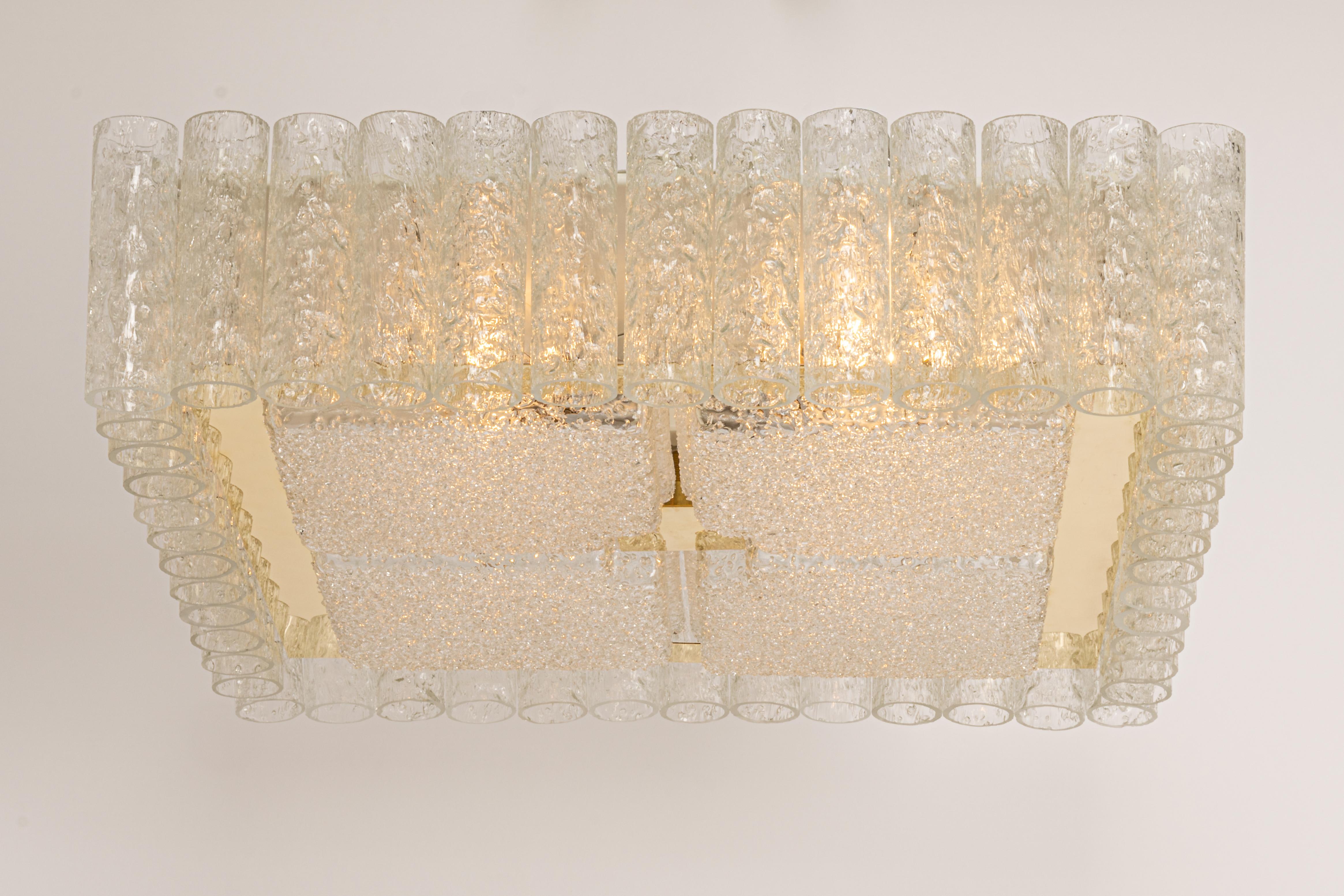 Large Fantastic mid-century Flush mount chandelier by Doria, Germany, manufactured, circa 1960-1969. Many Murano glass cylinders are suspended from the fixture.
Wonderful geometric design.
High quality and in very good condition. Cleaned,