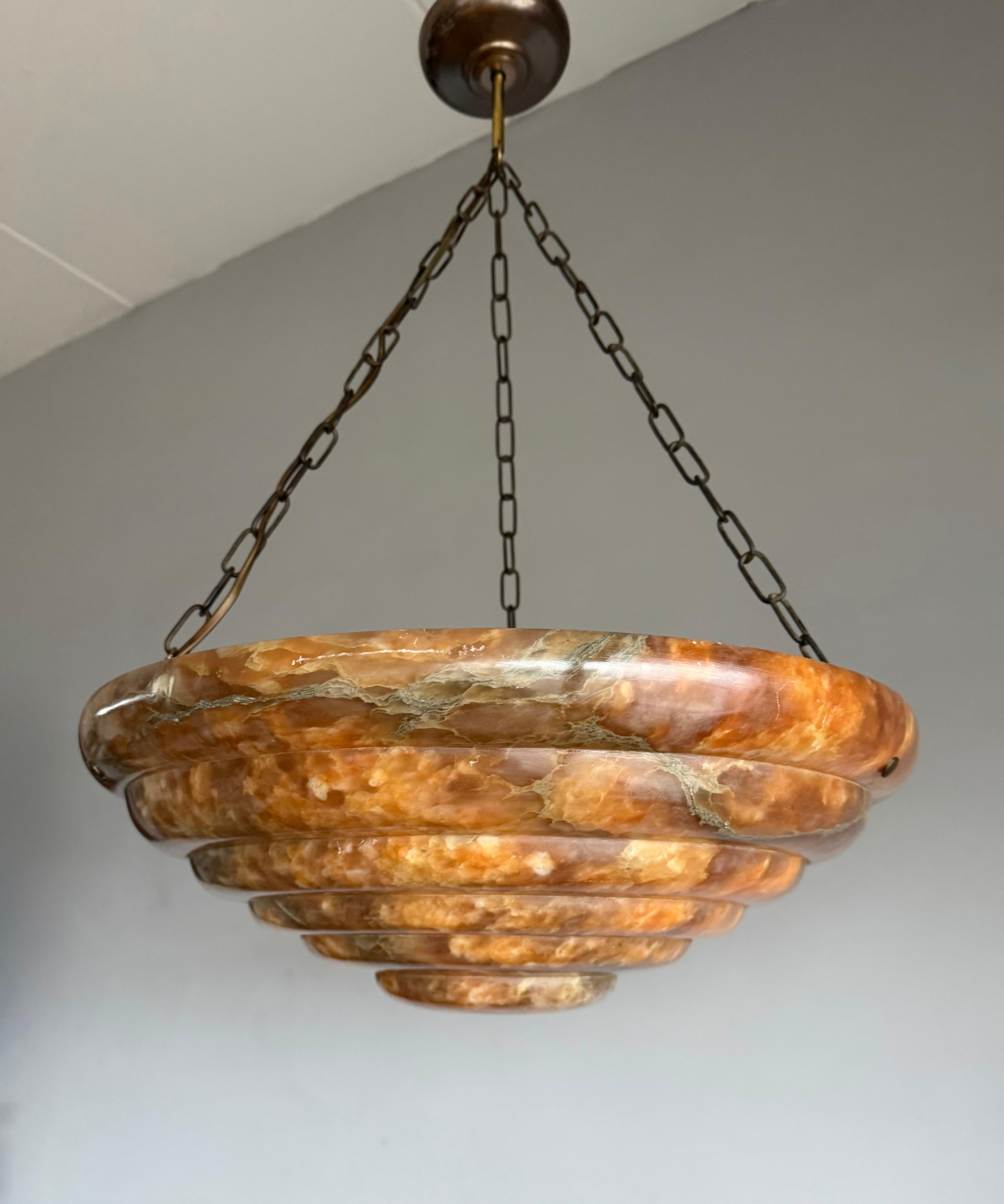 An exceptional and monumental Art Deco alabaster pendant light of rare beauty.

This magnificent and generously sized Art Deco pendant is without question one of our finest discoveries of the year. Every element, from the beautifully patinated,
