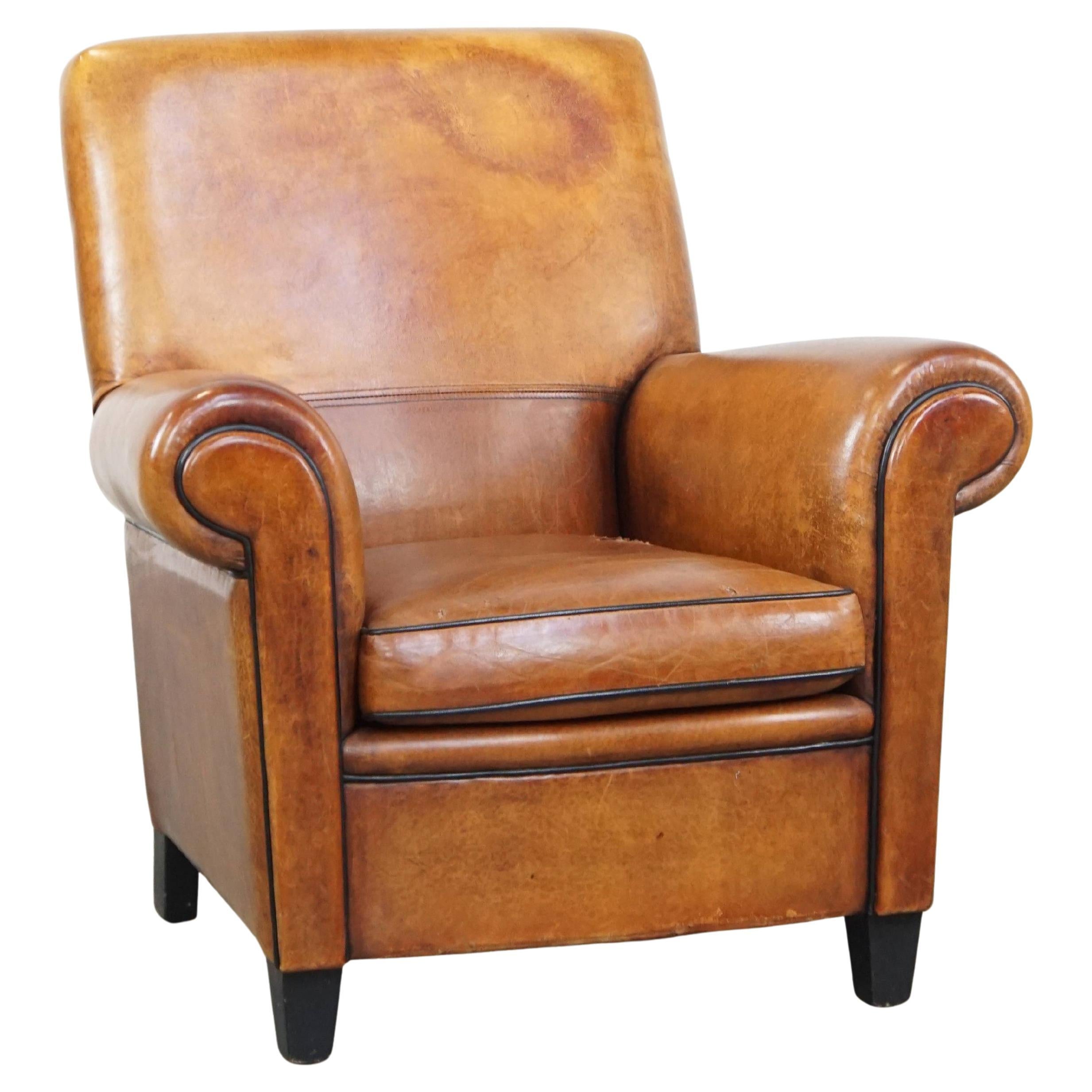 Large, sturdy, comfortable vintage cognac-colored sheepskin leather armchair