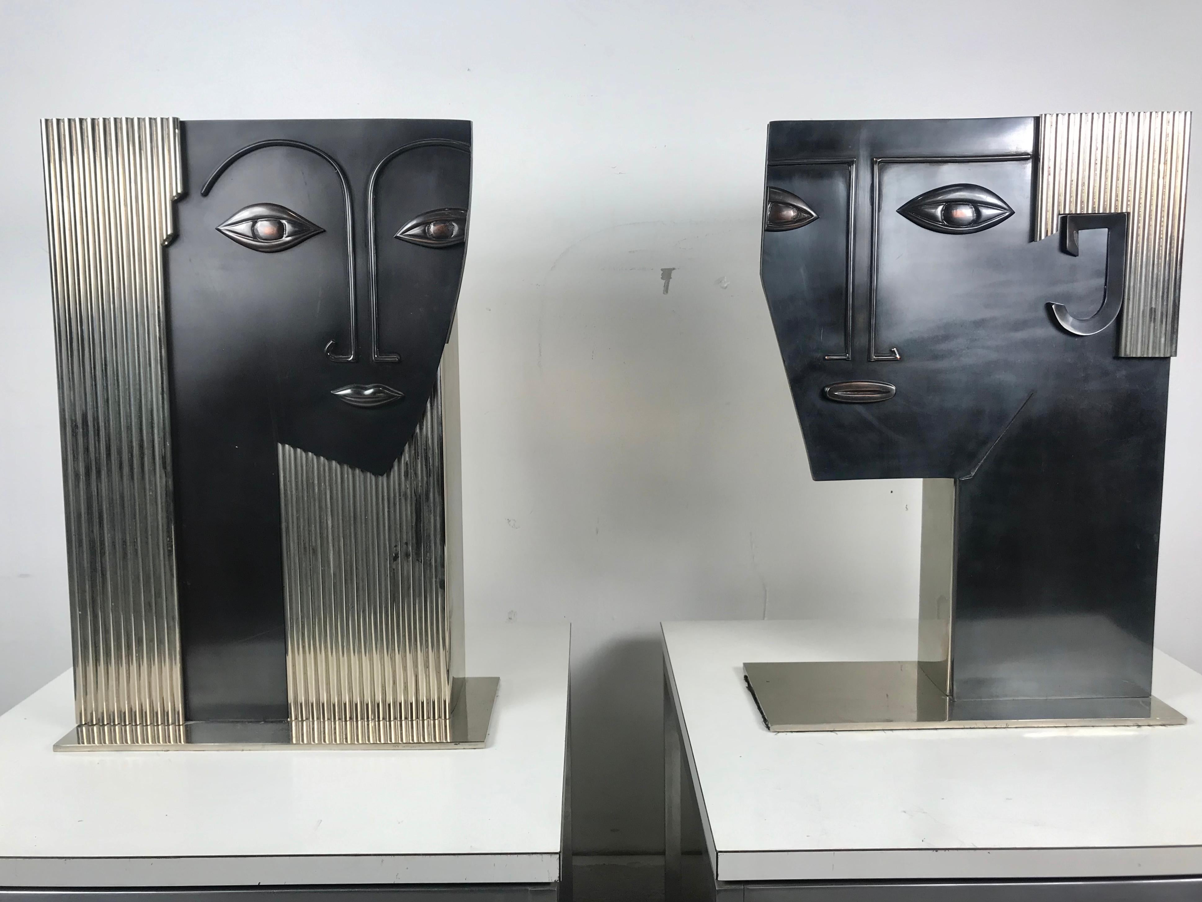 Large-scale pair of Art Deco stylized face vases of a man and woman after Franz Hagenauer. All metal, fine quality construction, nickel and what appears to be bronze. Extremely heavy.