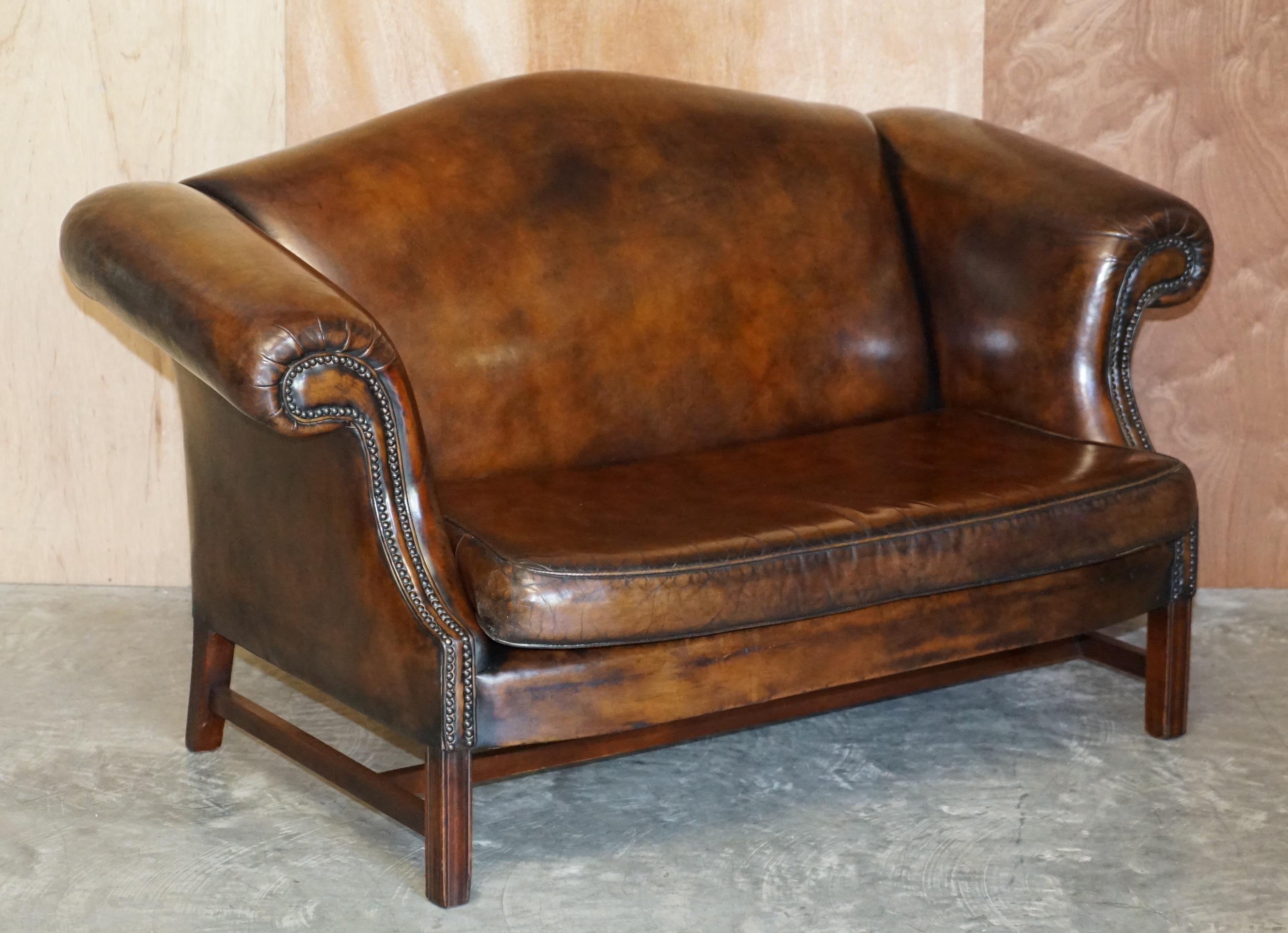 We are delighted to offer this lovely fully restored hand dyed brown leather camelback club sofa and armchair suite

Each piece is very comfortable, they all have padded and over stuffed backs, the leather has been hand nail tacked in place using
