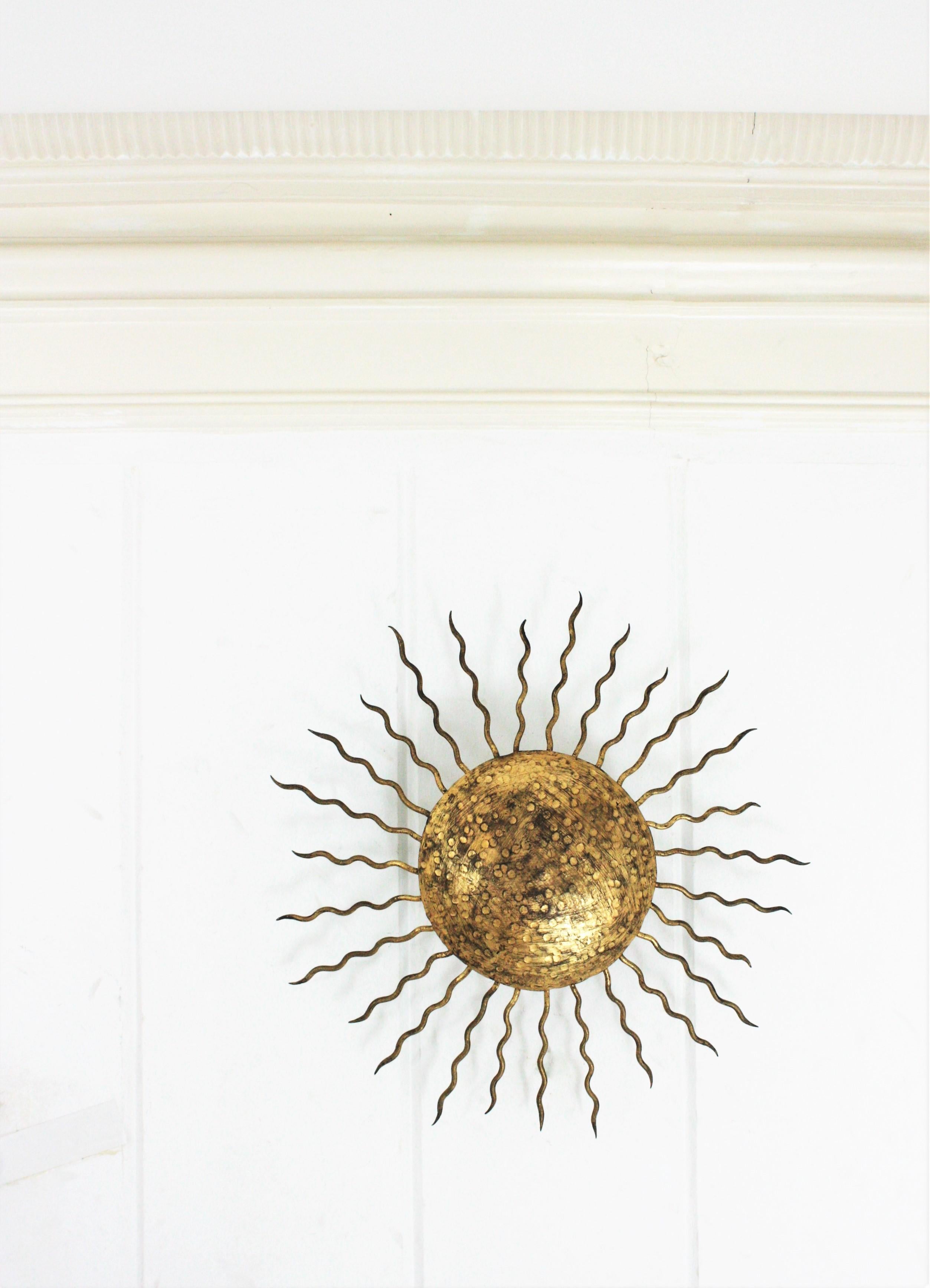 Large Sunburst Ceiling Light Fixture in Hand Hammered Gilt Iron, 1950s For Sale 1
