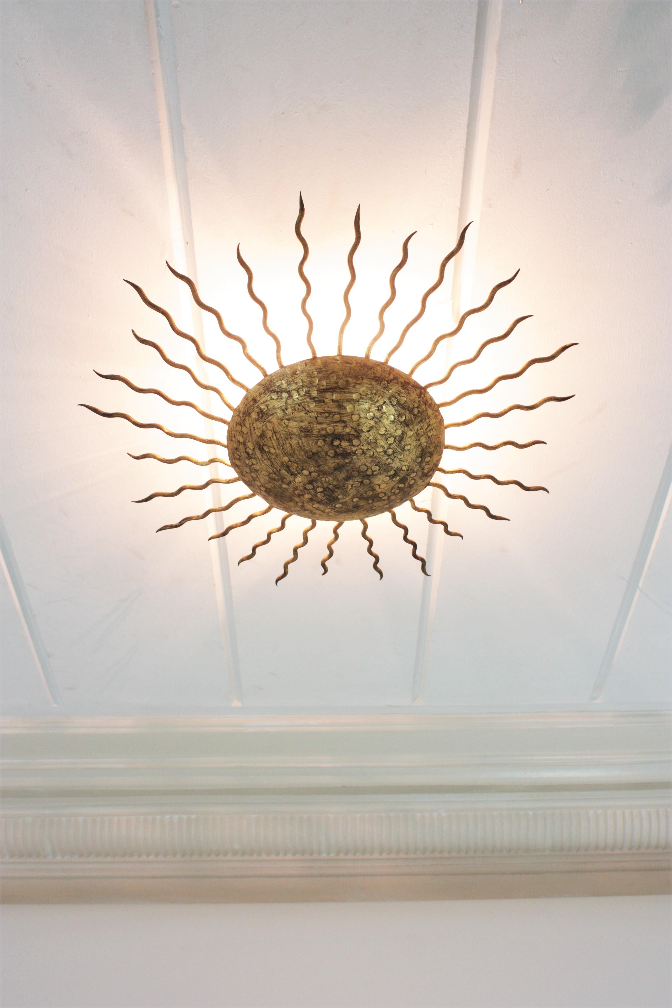 Large Sunburst Ceiling Light Fixture in Hand Hammered Gilt Iron, 1950s For Sale 3