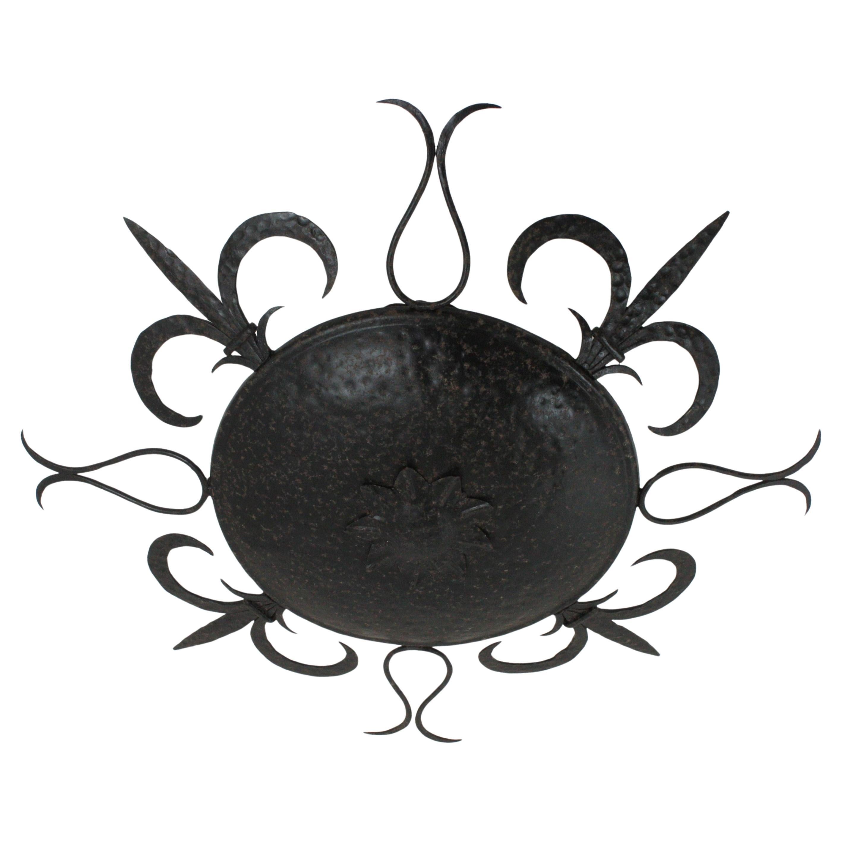 French Large Sunburst Ceiling Light Fixture in Wrought Iron, Fleur de Lys Motifs, 1940s For Sale