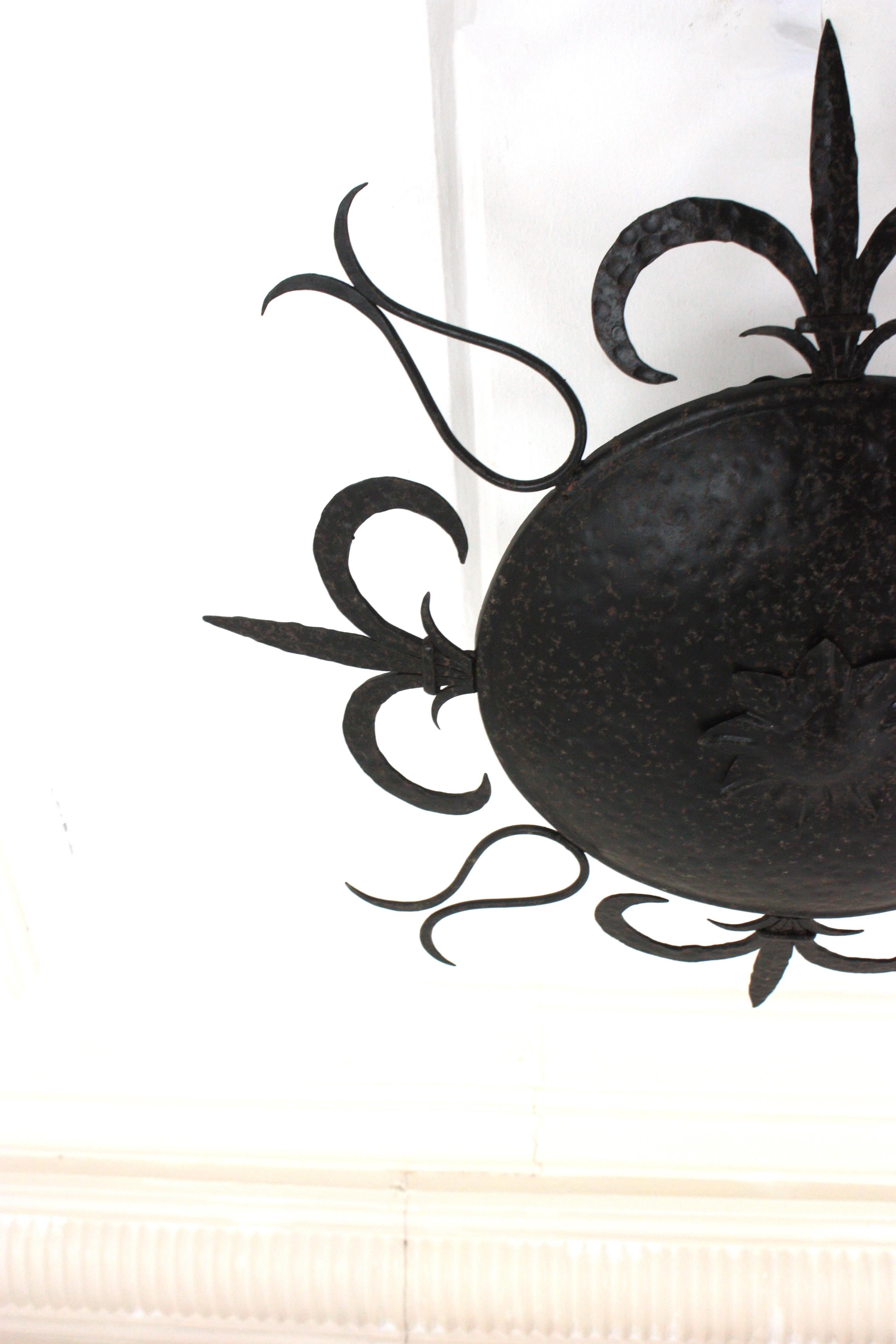 Large Sunburst Ceiling Light Fixture in Wrought Iron, Fleur de Lys Motifs, 1940s For Sale 2