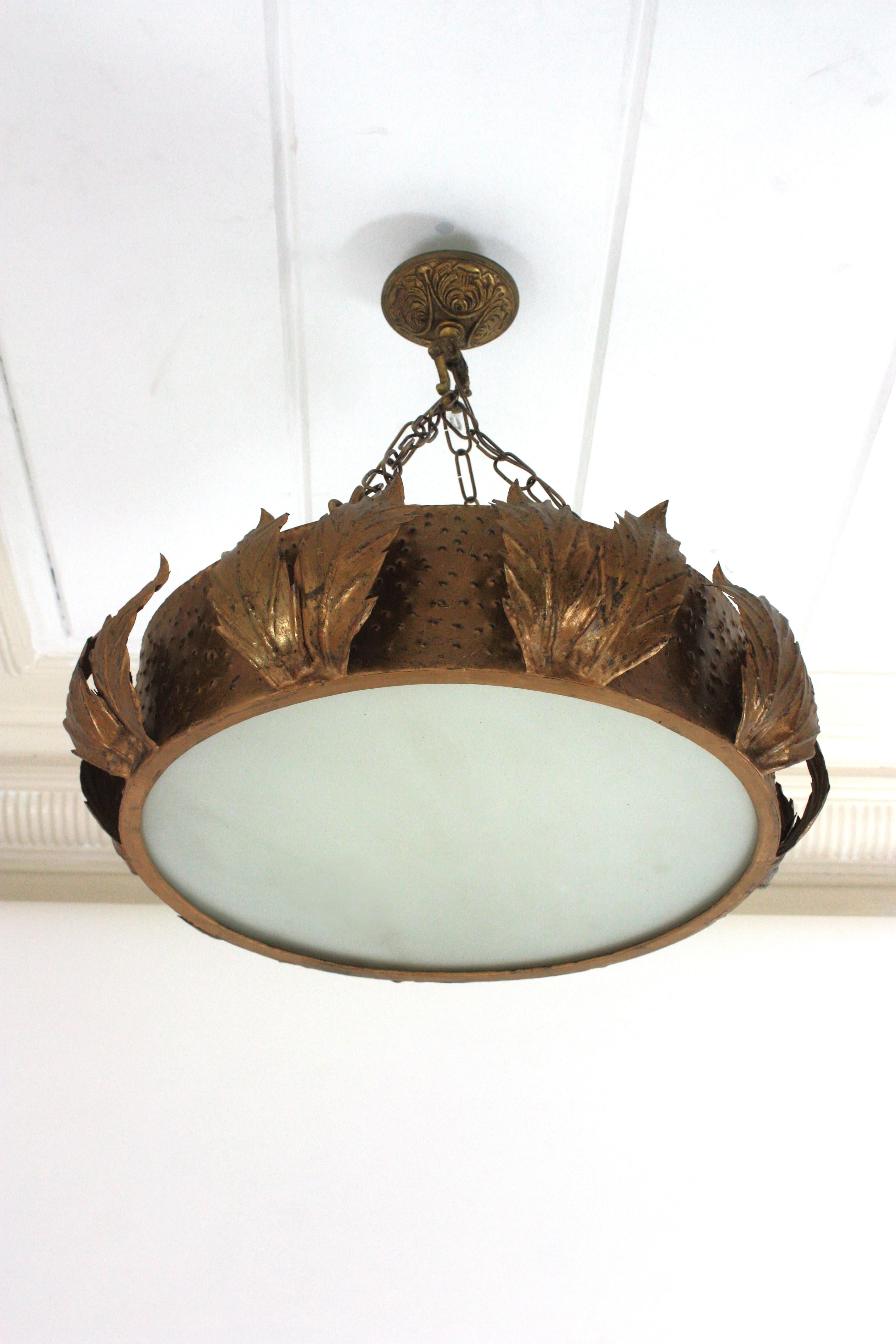 Crown Chandelier Foliage Ceiling Light Fixture, Gilt Metal, Gold Leaf, Frosted Glass
____________________________________________________________
Gilt iron and bronze sunburst crown shape chandelier or ceiling light fixture with frosted glass,