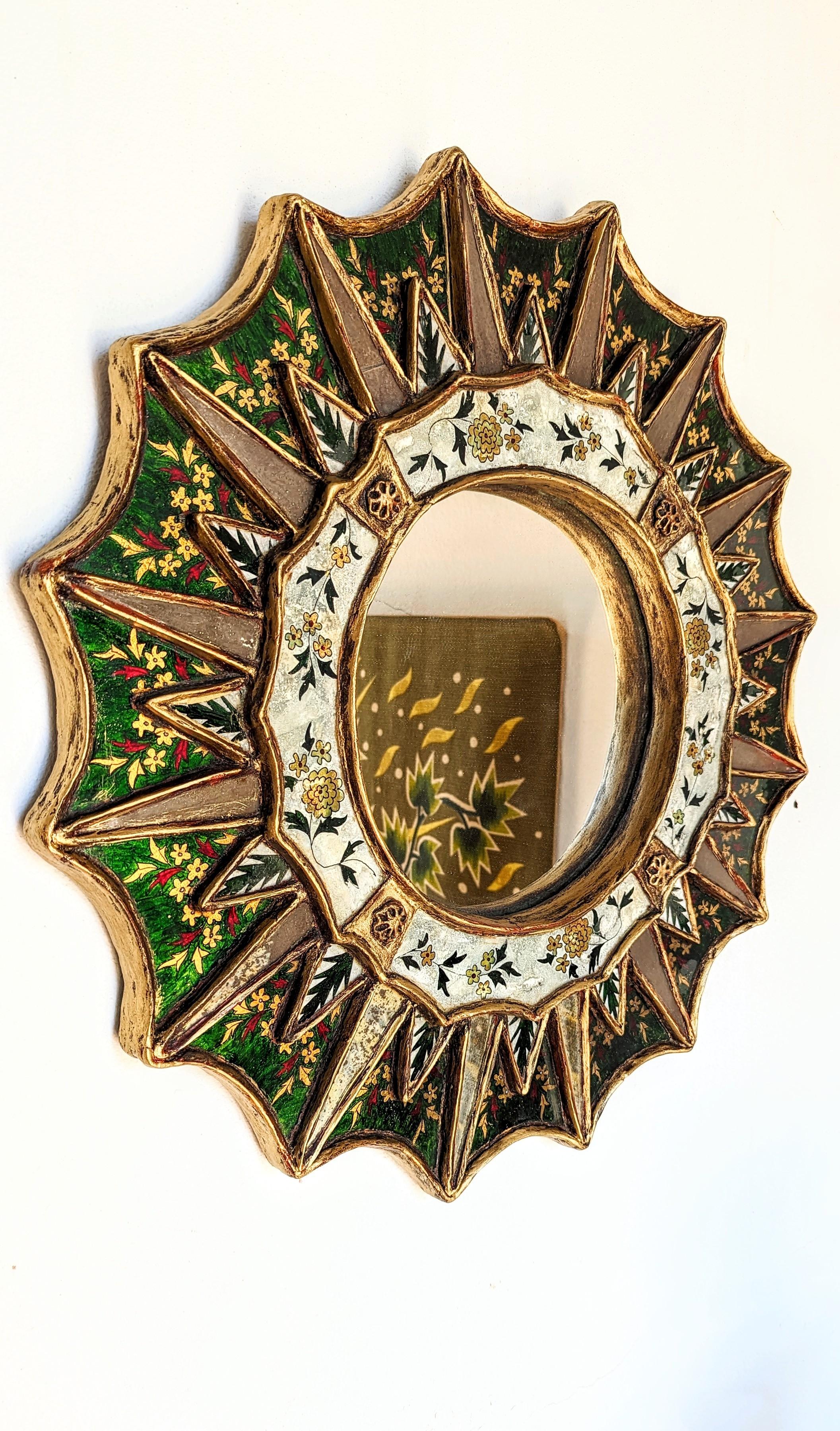 Rare and beautiful large sunburst flower painting gold mirror manufactured in Spain in 1960s.
Incredible work of painting on mirror, incredible color, green emerald and gold.
Very decorative furniture.