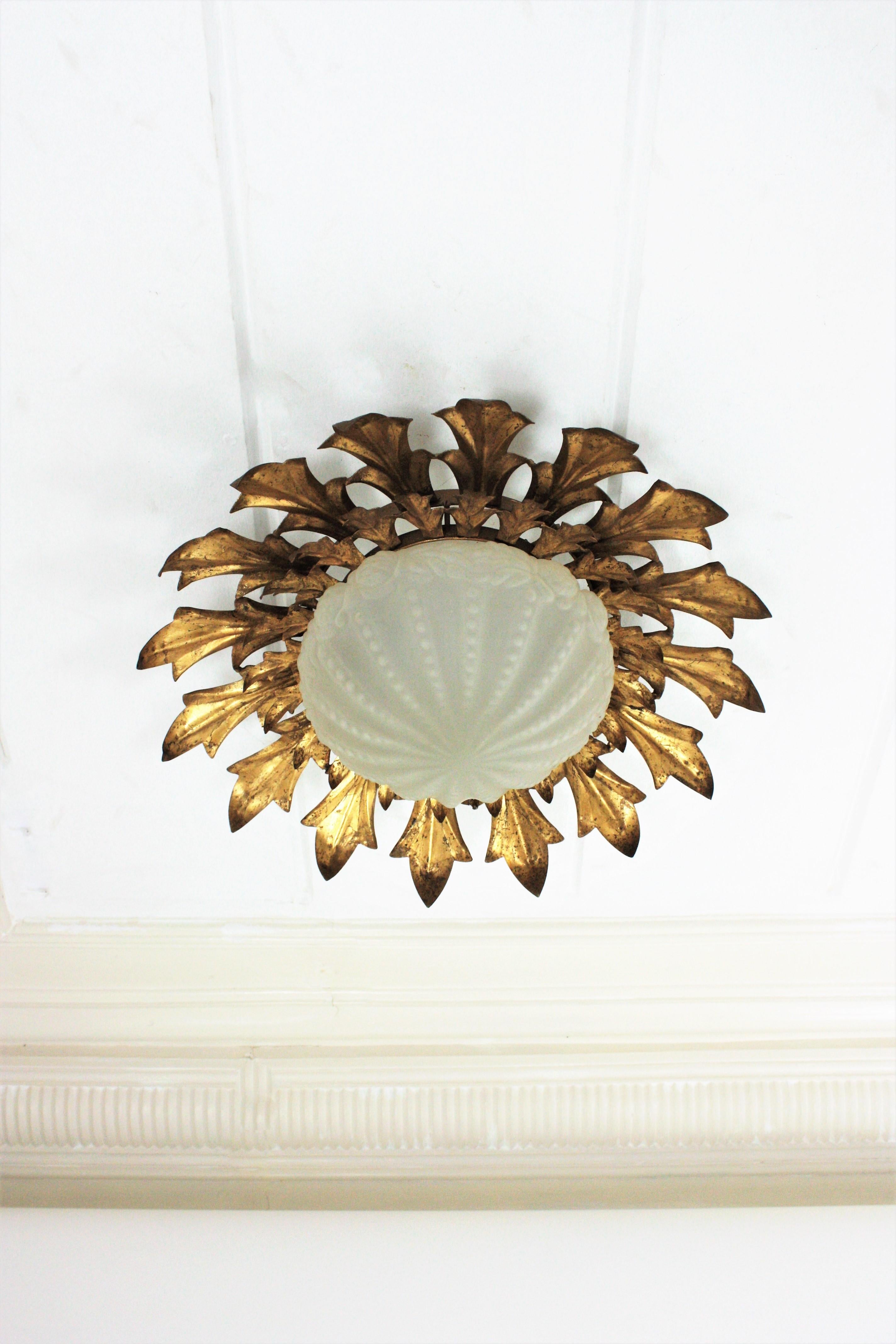 Spanish Large Sunburst Flush Mount in Gilt Iron with Frosted Glass Globe For Sale