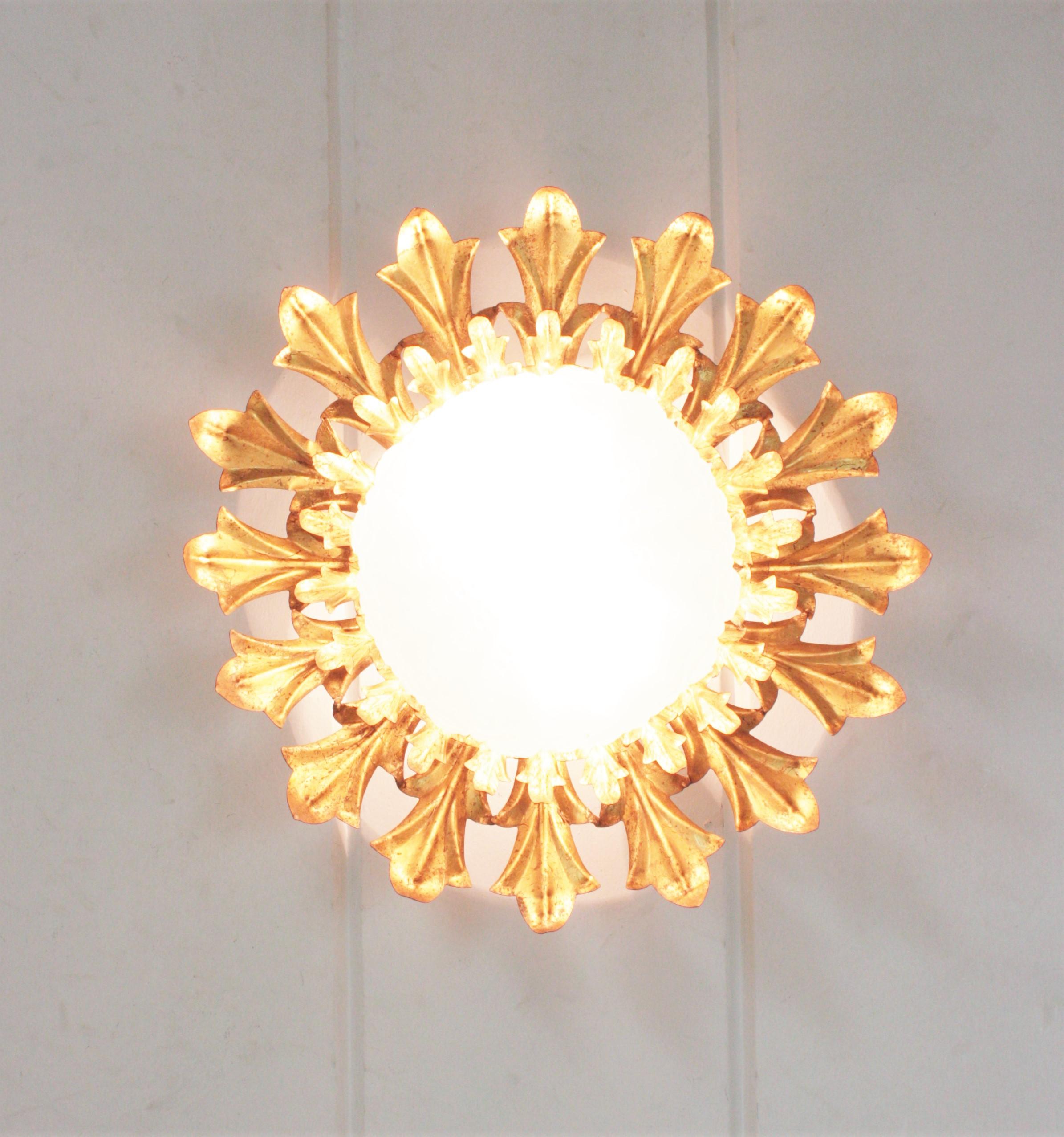 Large Sunburst Flush Mount in Gilt Iron with Frosted Glass Globe In Good Condition For Sale In Barcelona, ES