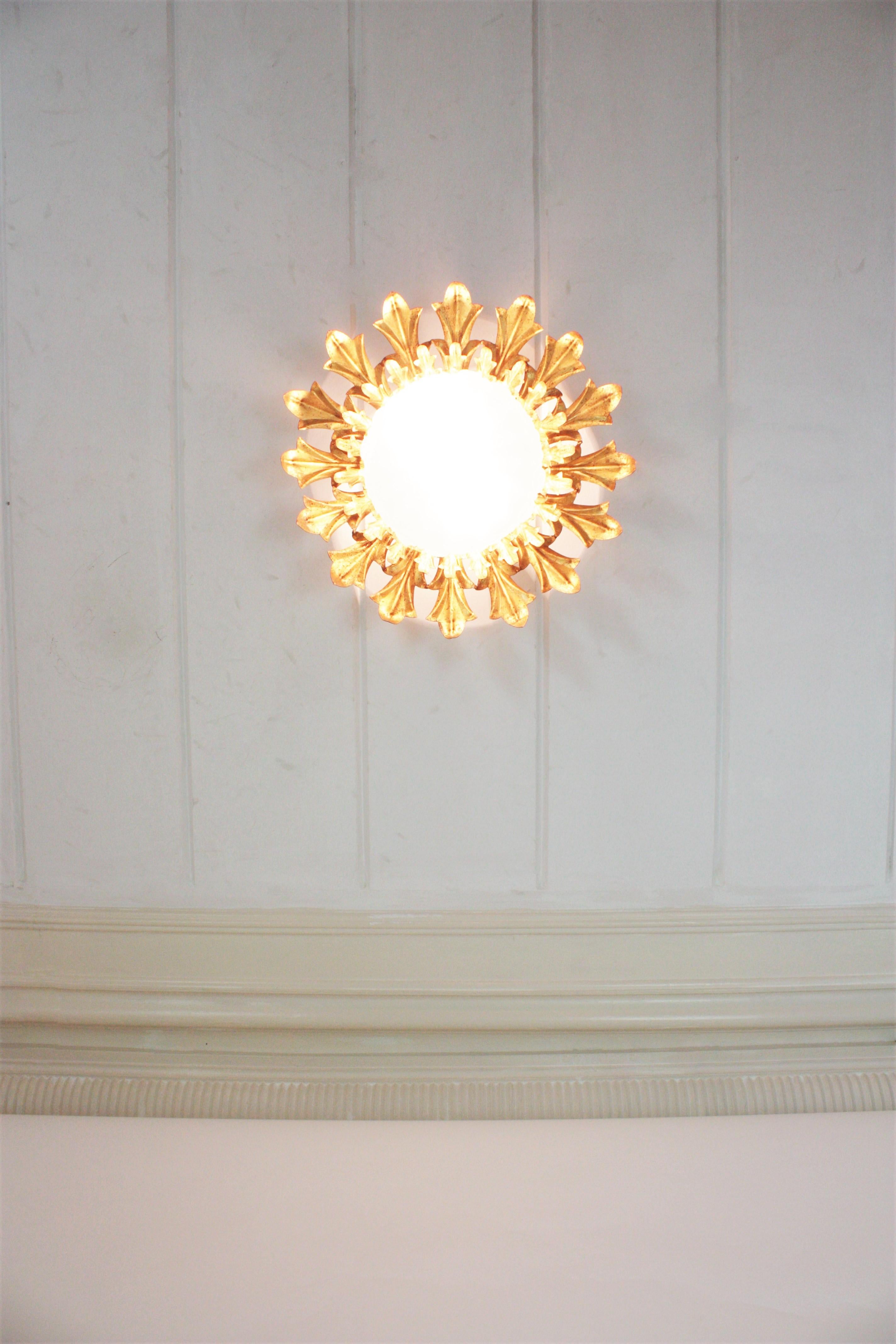 Large Sunburst Flush Mount in Gilt Iron with Frosted Glass Globe For Sale 3