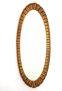Large Sunburst Giltwood Oval Mirror by Francisco Hurtado