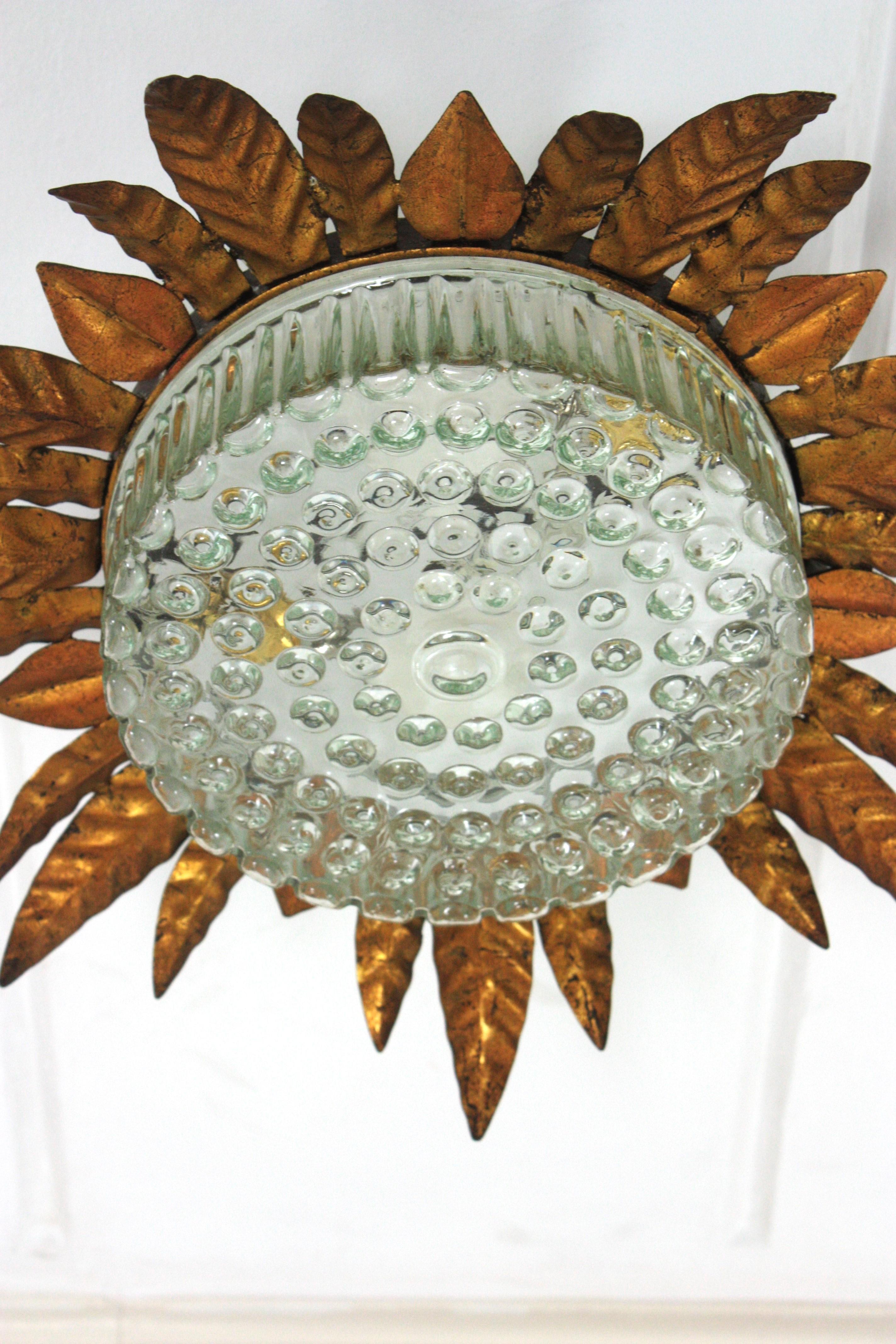 Large Sunburst Leafed Ceiling Light Fixture in Gilt Iron and Pressed Glass For Sale 3