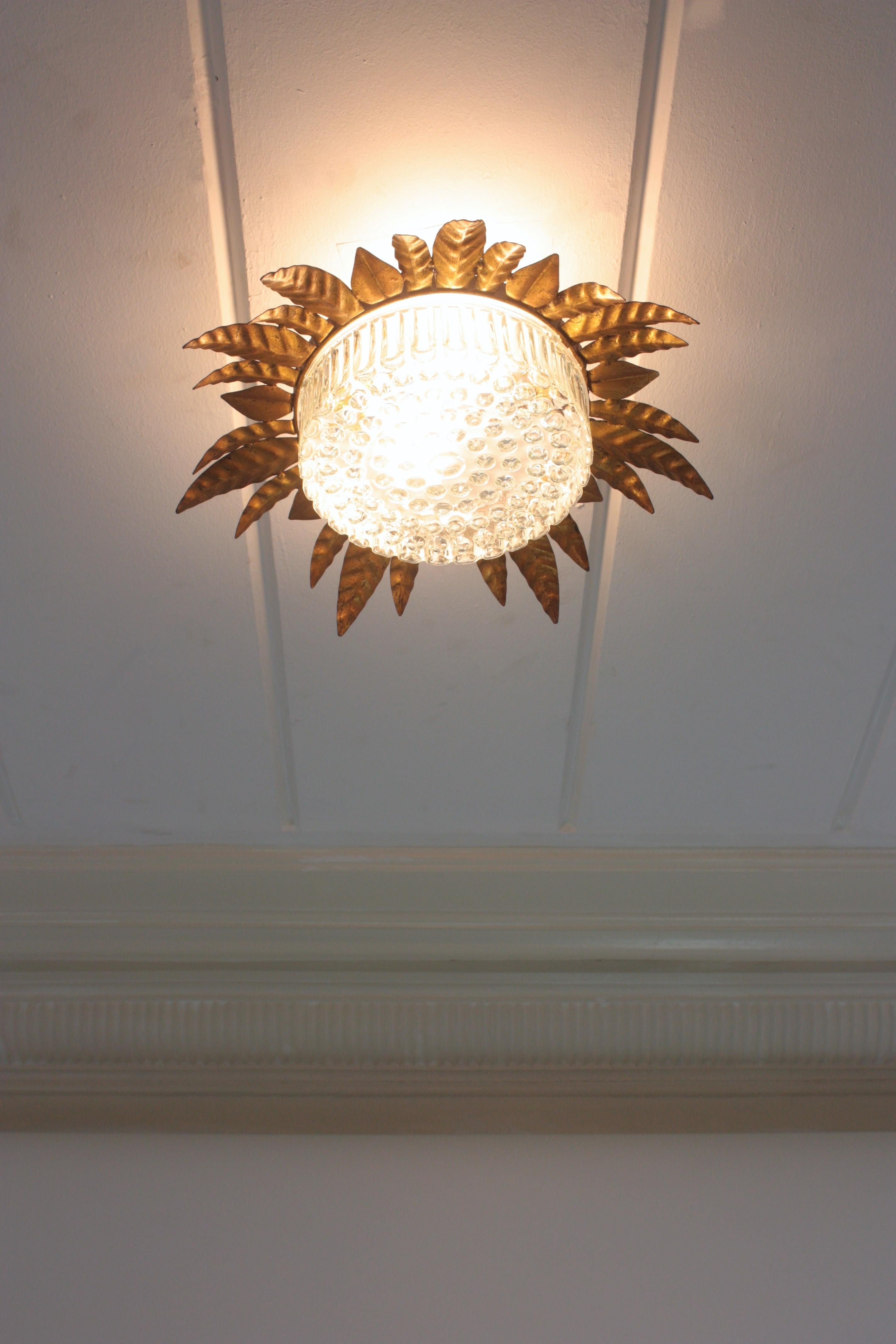 Large Sunburst Leafed Ceiling Light Fixture in Gilt Iron and Pressed Glass For Sale 5