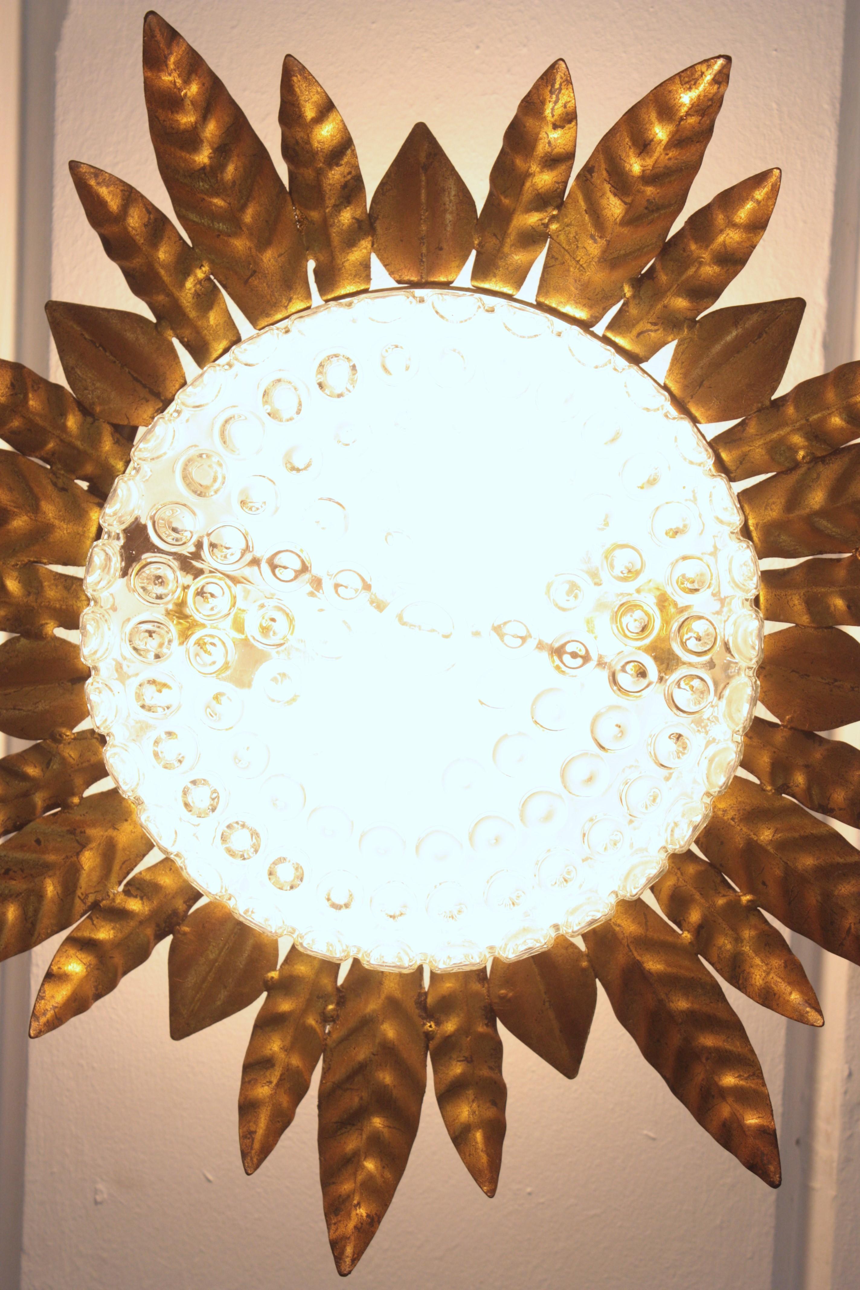Large Sunburst Leafed Ceiling Light Fixture in Gilt Iron and Pressed Glass For Sale 8
