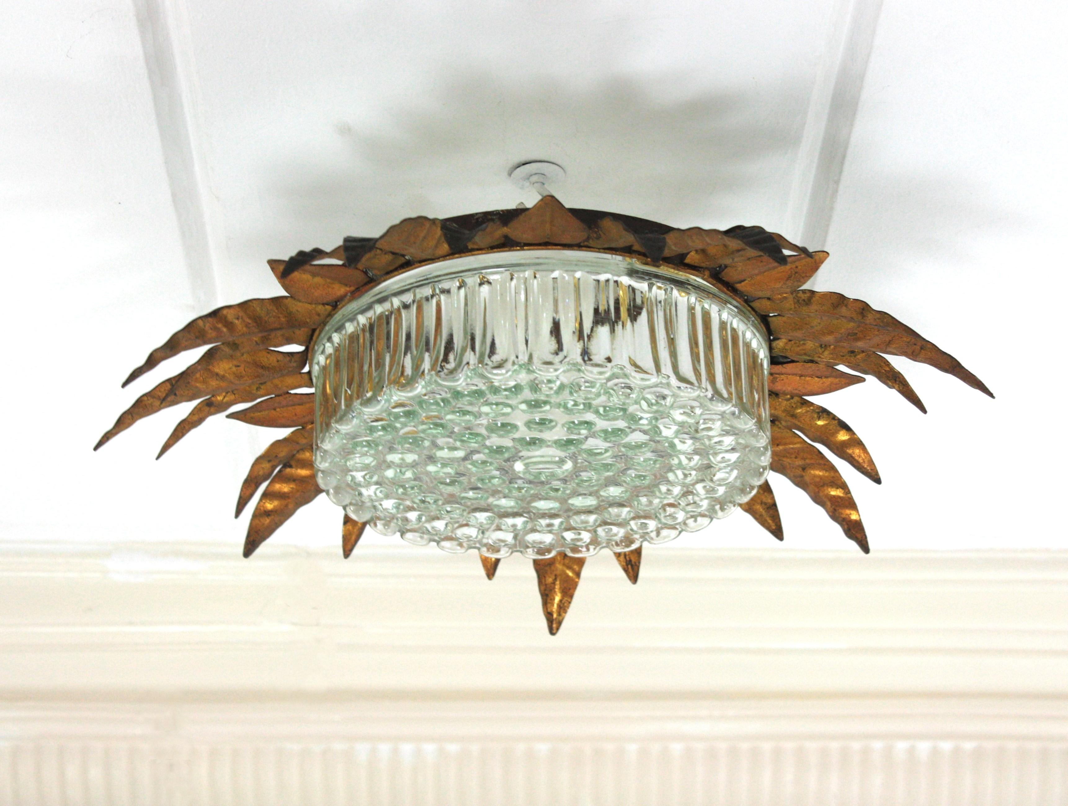 Large Sunburst Leafed Ceiling Light Fixture in Gilt Iron and Pressed Glass For Sale 9