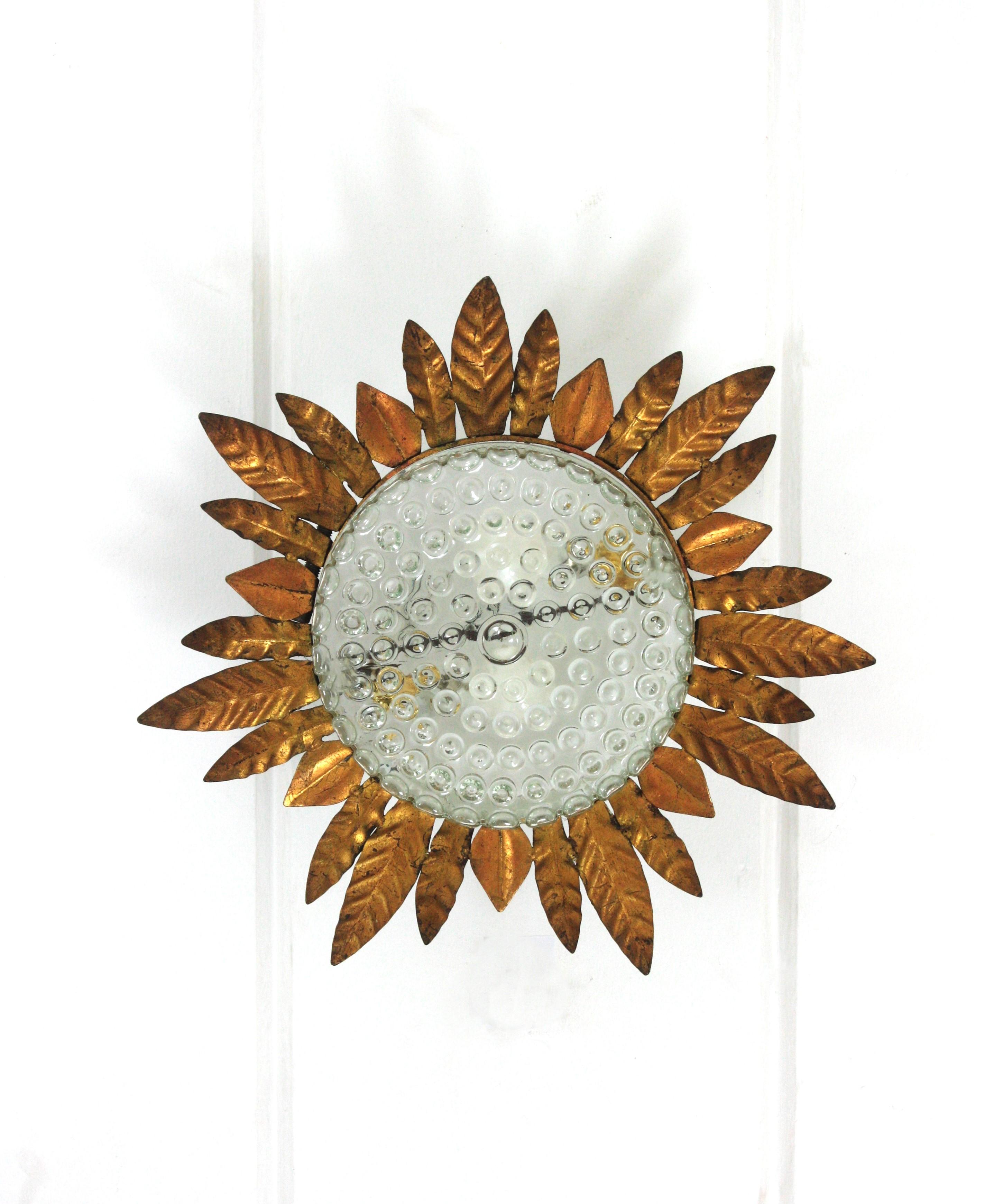 Spanish Large Sunburst Leafed Ceiling Light Fixture in Gilt Iron and Pressed Glass For Sale