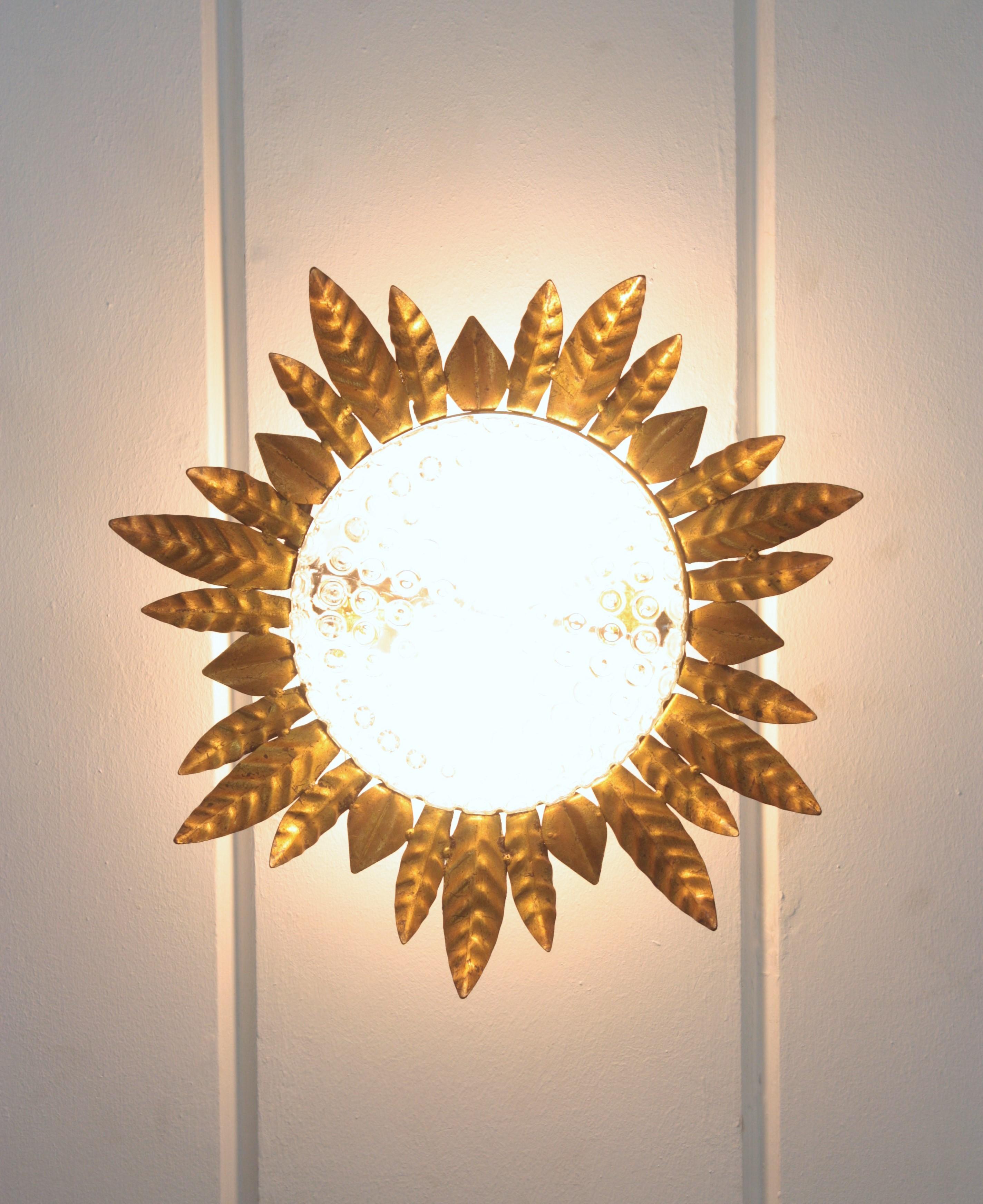 Metal Large Sunburst Leafed Ceiling Light Fixture in Gilt Iron and Pressed Glass For Sale