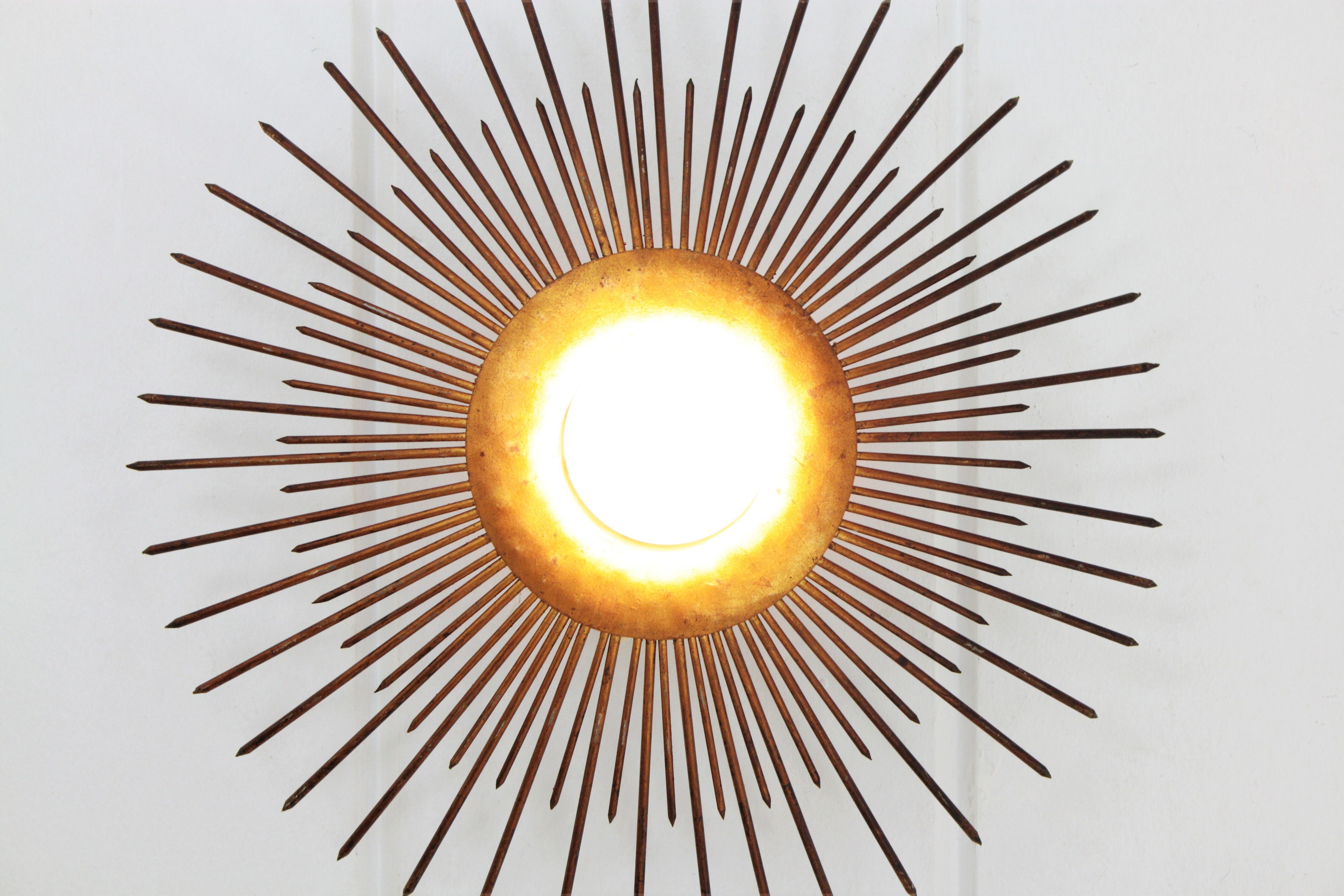 Large Sunburst Light Fixture in Gold Leaf Gilt Iron, France, 1940s 4