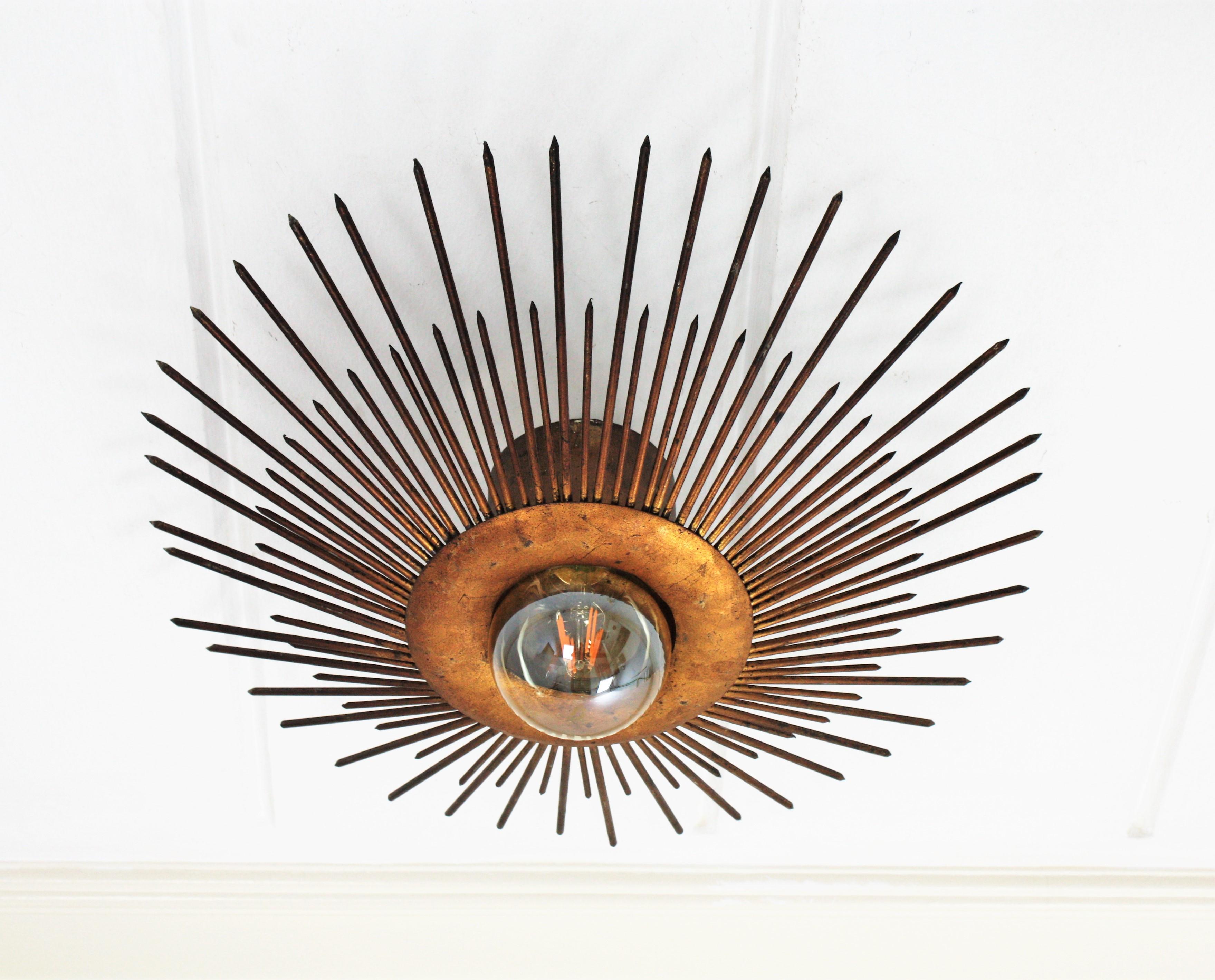 Art Deco Large Sunburst Light Fixture in Gold Leaf Gilt Iron, France, 1940s