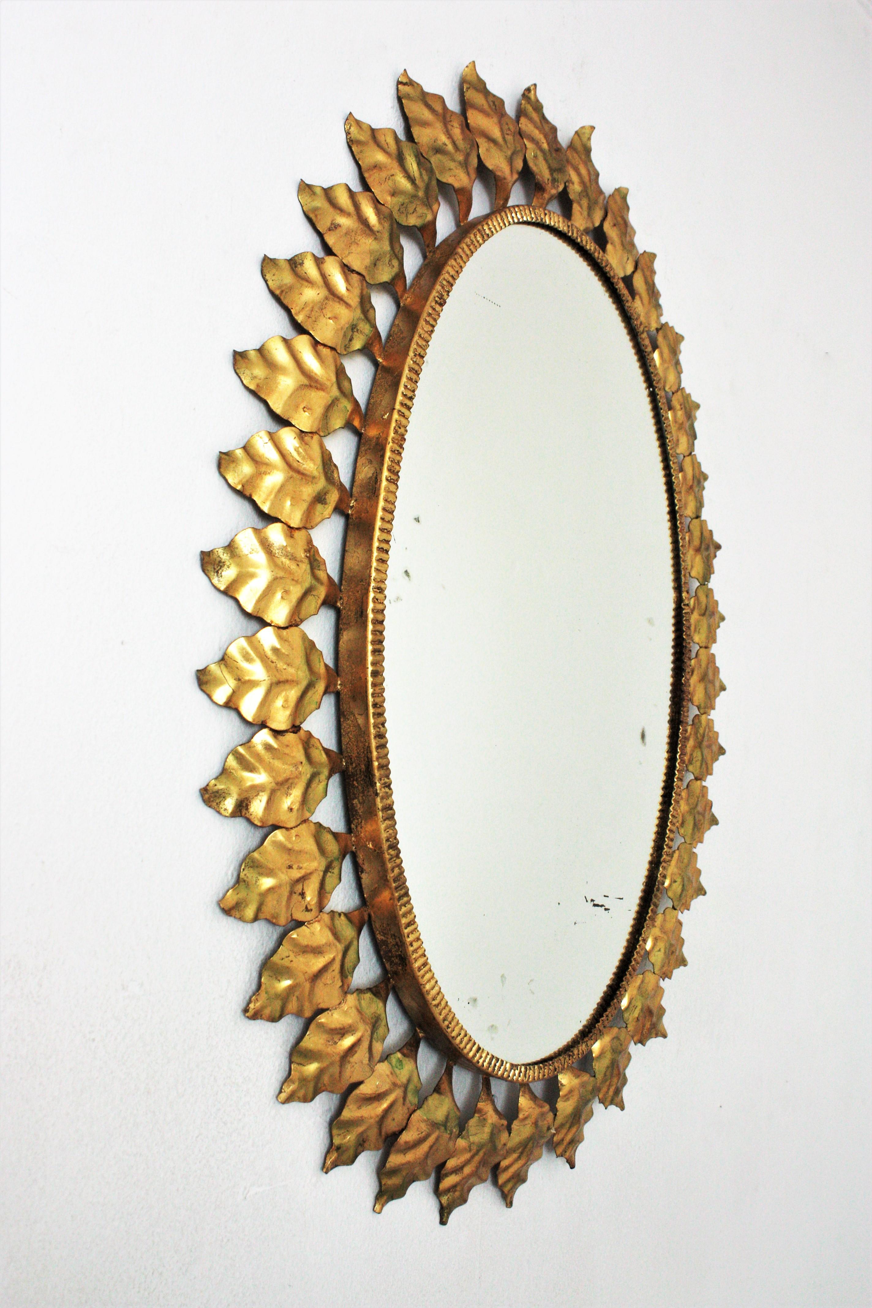 20th Century Sunburst Oval Mirror in Gilt Iron, 1950s For Sale