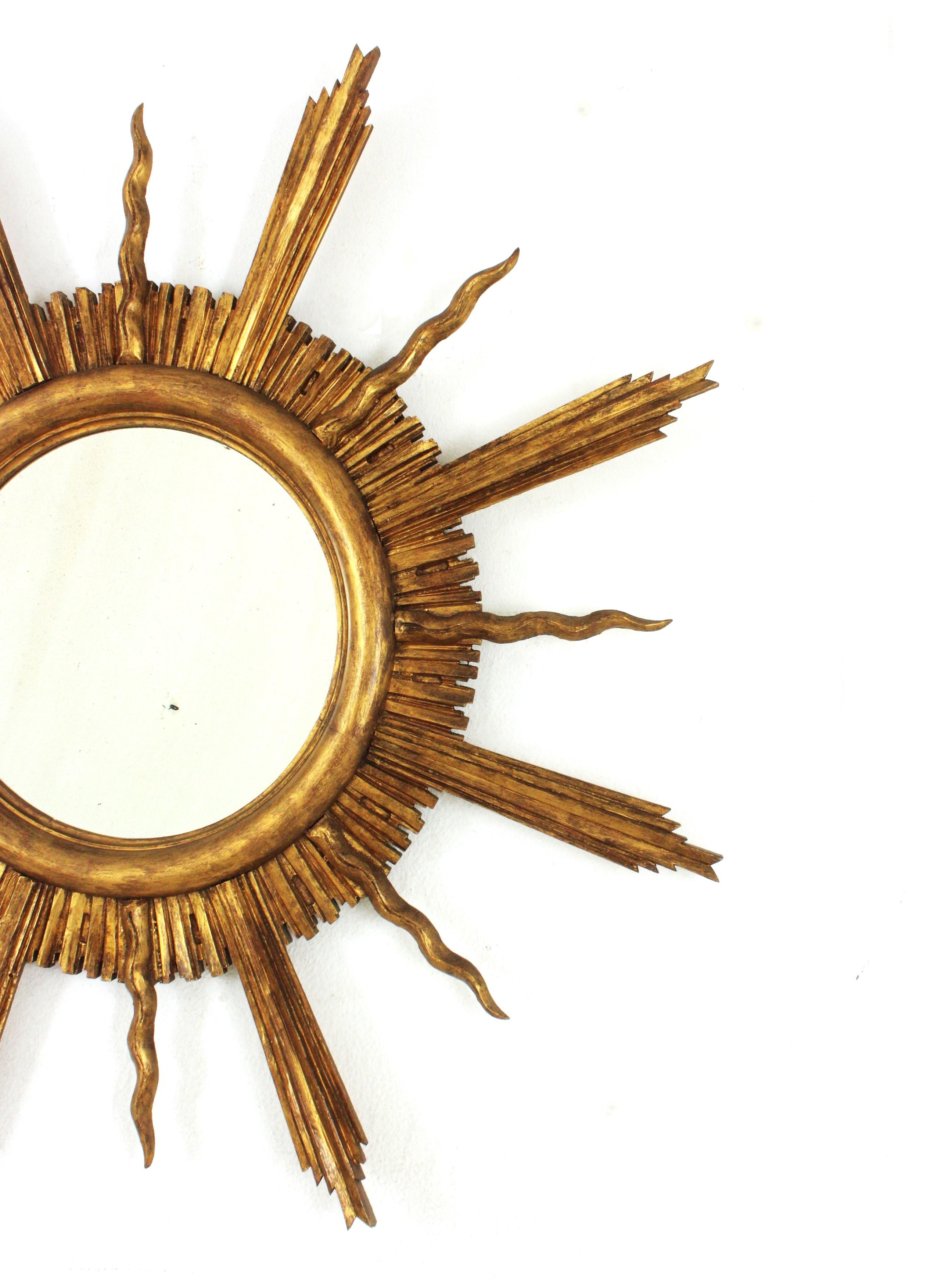 Large Sunburst Starburst Giltwood Mirror in the Style of Gilbert Poillerat In Good Condition For Sale In Barcelona, ES