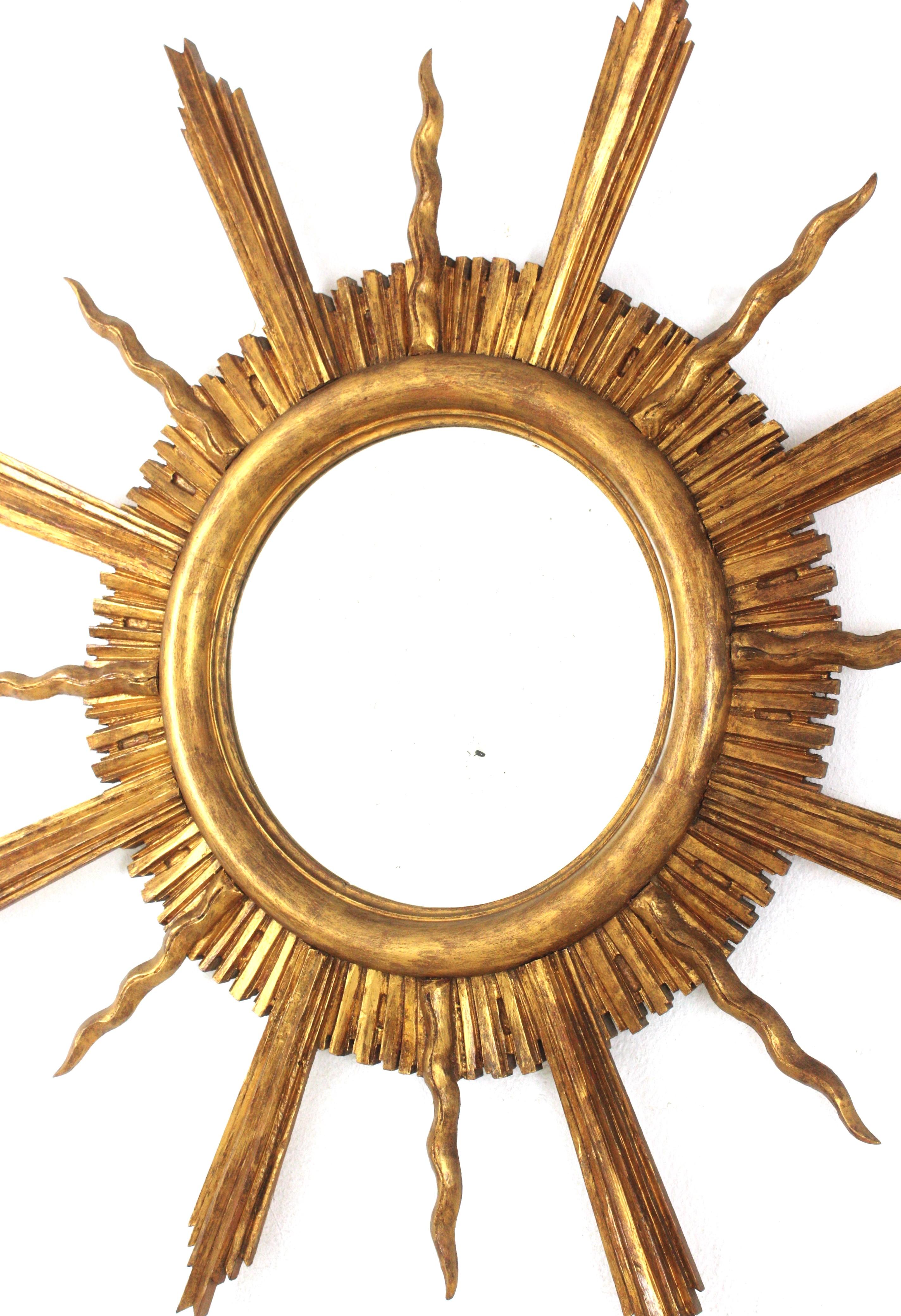 Large Sunburst Starburst Giltwood Mirror in the Style of Gilbert Poillerat For Sale 1