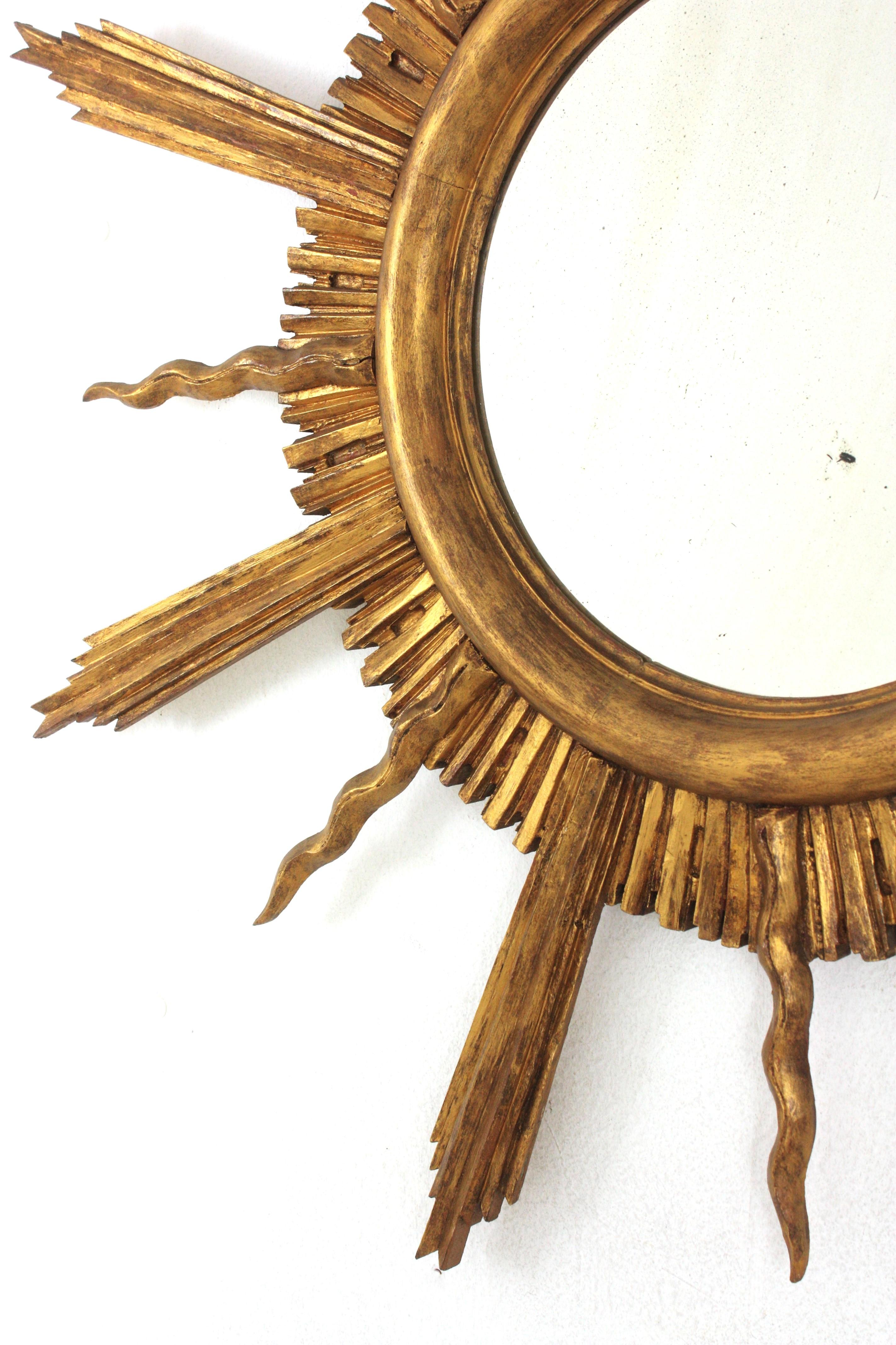 Large Sunburst Starburst Giltwood Mirror in the Style of Gilbert Poillerat For Sale 2