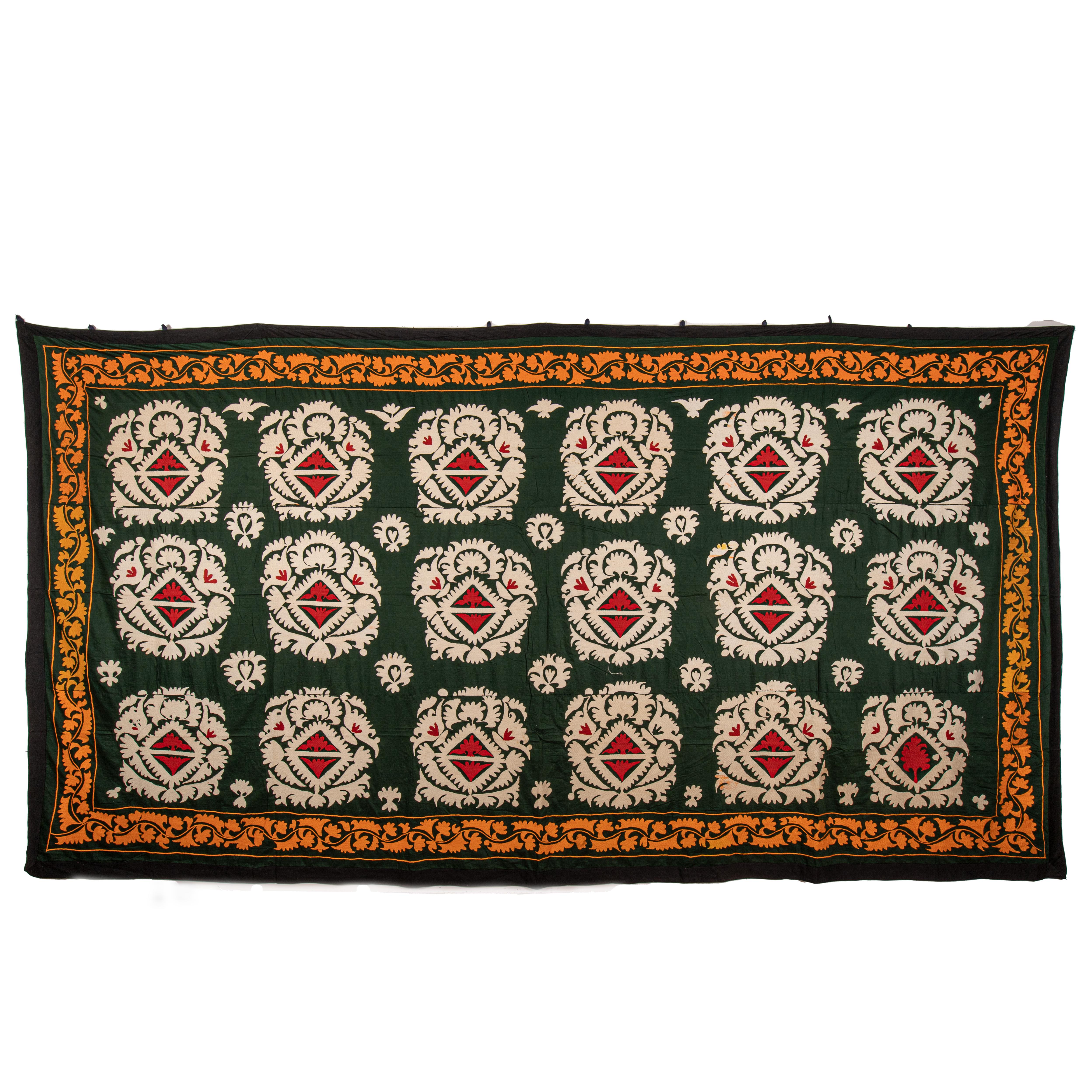 This is a vintage, large Suzani embroidered in cotton from Samarkand Uzbekistan dating back to mid 20th Centry.