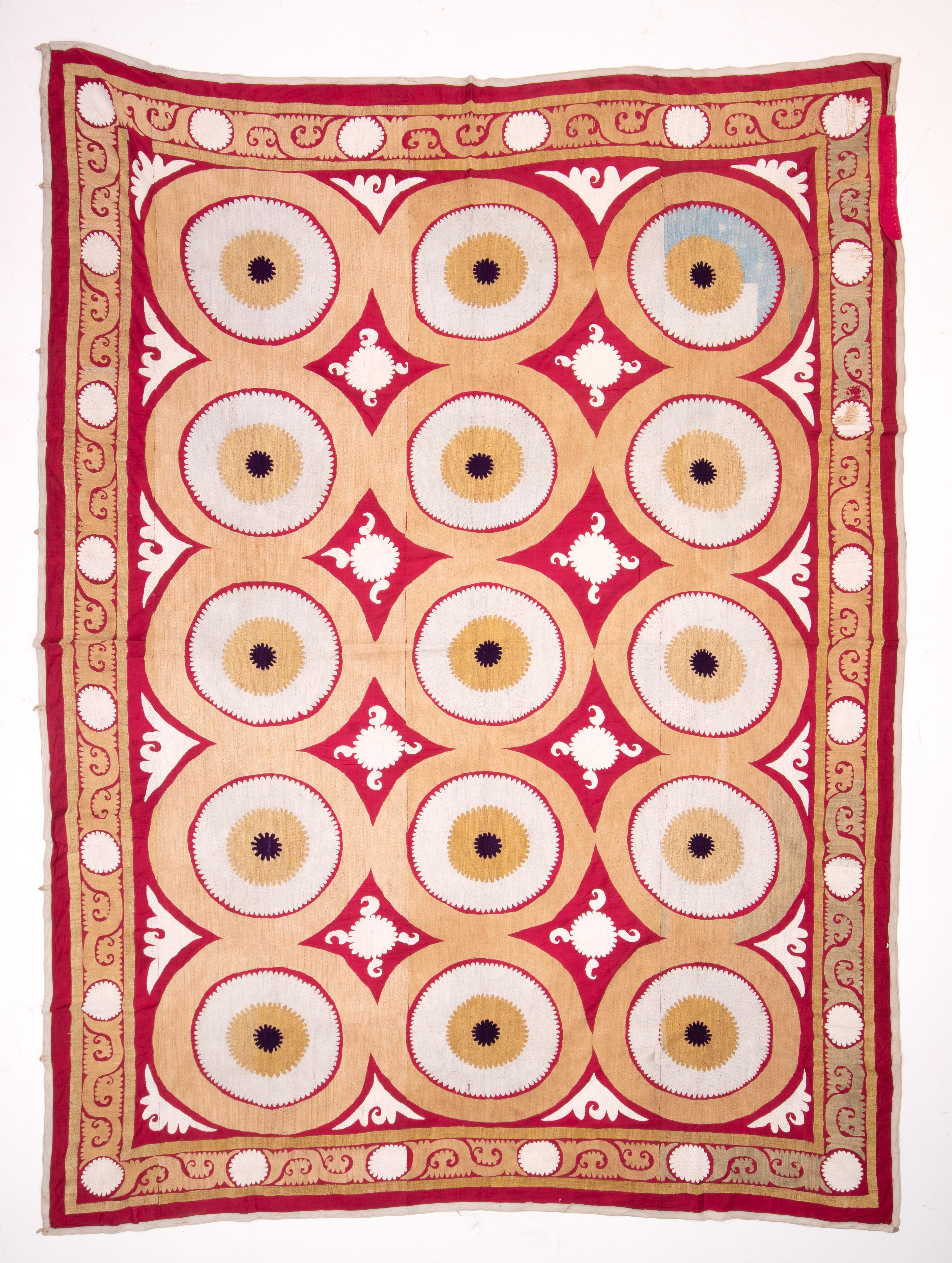 This suzani has a different design, embroidered in cotton on a cotton red ground. No lining.