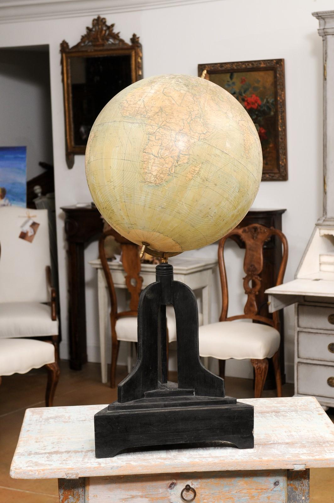 Large Swedish 1910s Freestanding Terrestrial Globe on Black Carved Base In Good Condition For Sale In Atlanta, GA