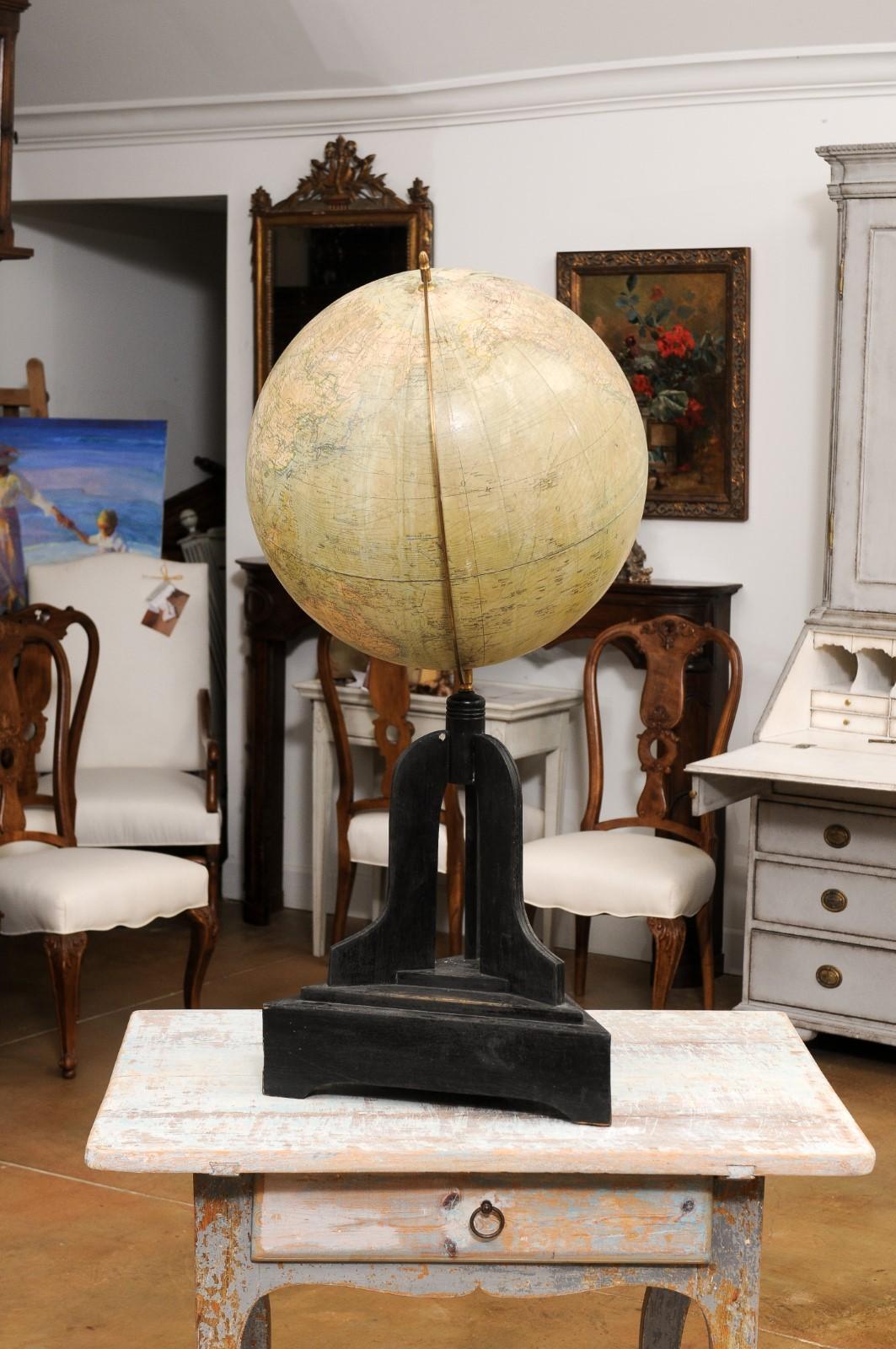 20th Century Large Swedish 1910s Freestanding Terrestrial Globe on Black Carved Base For Sale