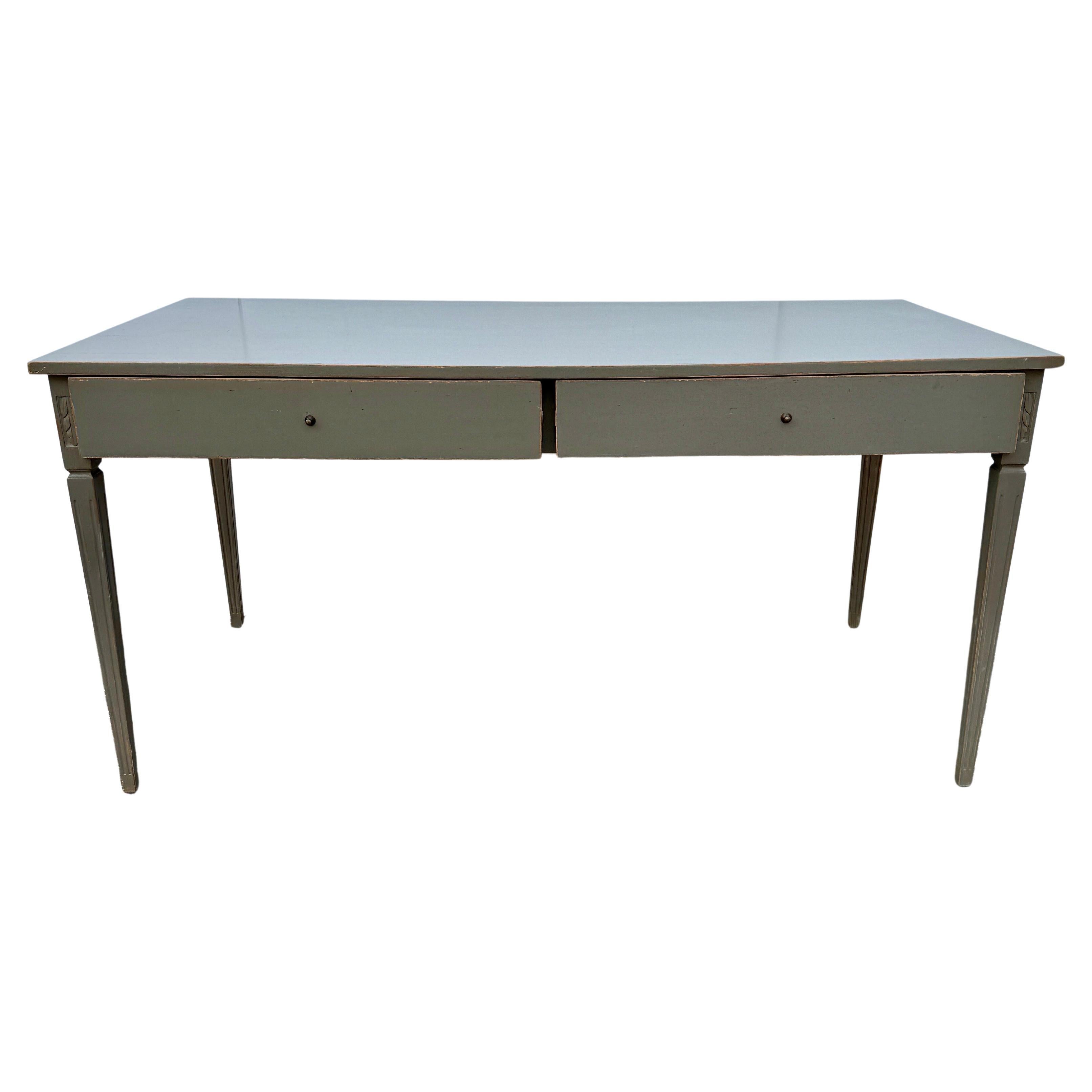 Large Painted Grey Green Gustavian Style Two Drawer Writing Table Desk, Sweden

Classic and Scandinavian style writing desk. Hand-carved and hand-painted. 
Drawer knobs are patinated bronze. Wonderful piece for a home office, library or sitting