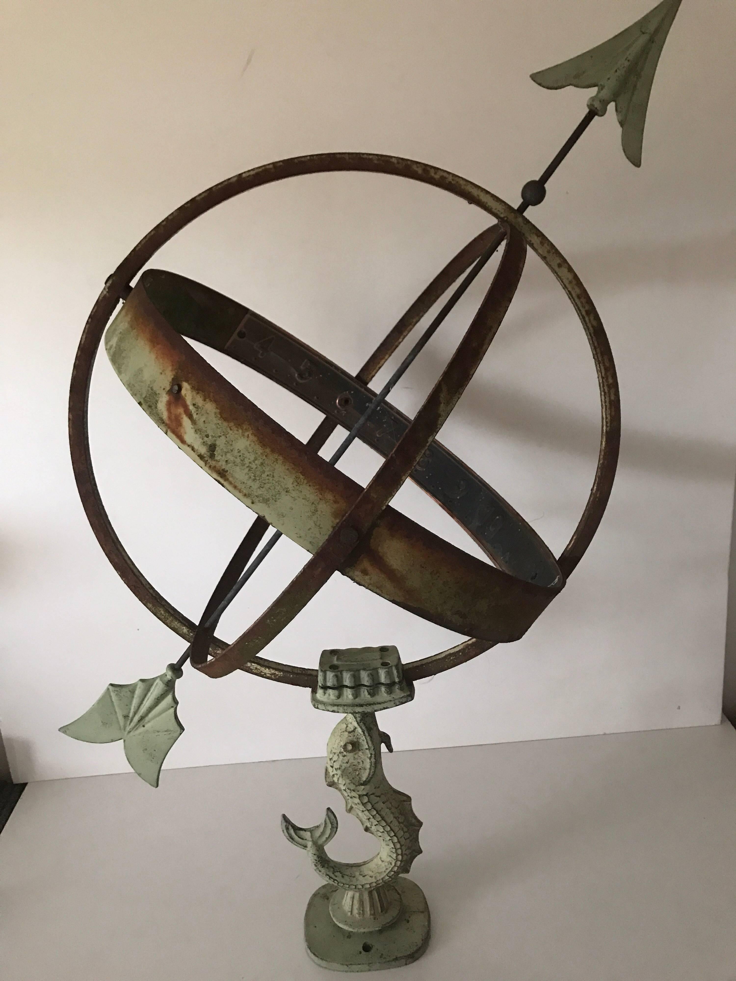 Large Swedish mid-20th century wrought iron and copper garden sundial.
A rare and beautiful garden sundial made of wrought iron and copper. The fish that holds the sundial is made of metal patinated to look like oxidized copper. There is a marking