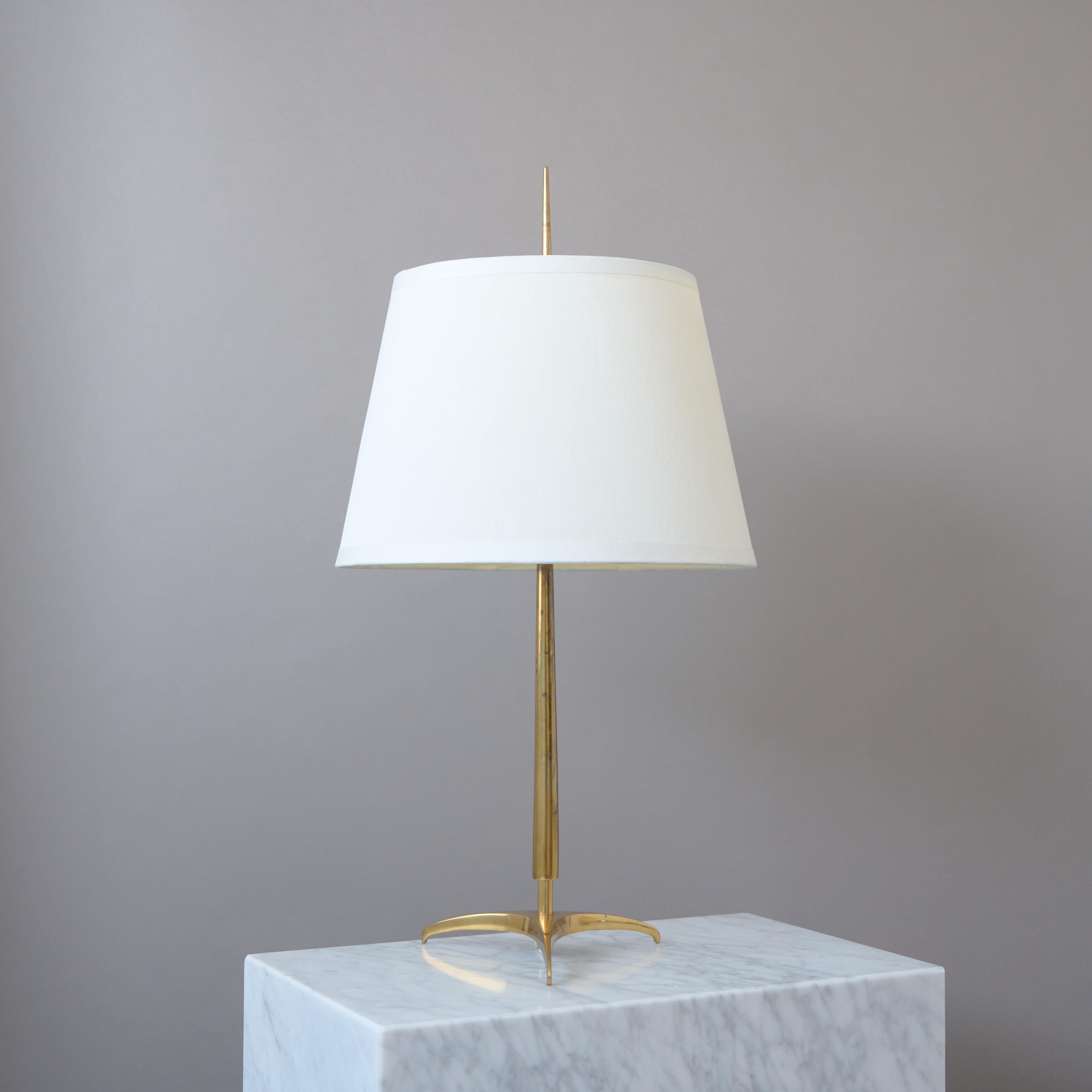 A rare and oversized Scandinavian Modern brass table lamp with original fabric shade.

Made by Christian Bergh & Co (CeBe) for ASEA belysning in Sweden, 1950s.

Great original condition with amazing patina.
Signed. Sold with the original
