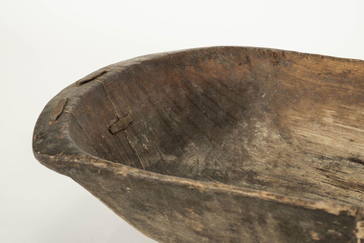 Large Swedish rustic trencher bowl, hand-carved in beech. Old iron staple repairs. Dates to 19th century.

Note: Original/early finish on antique and vintage metal will include some, or all, of the following: patina, scaling, light rust,