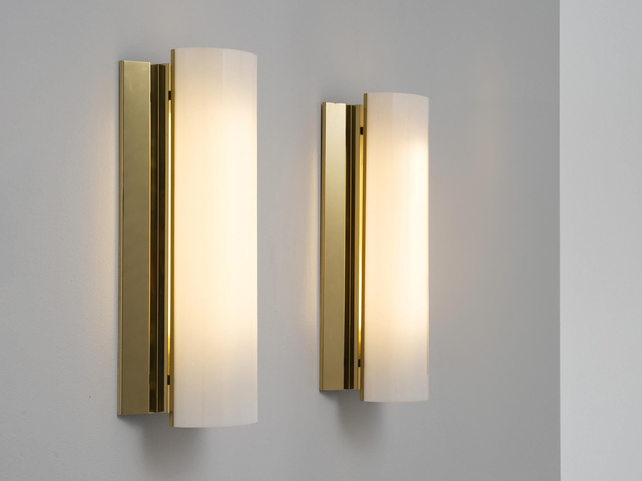 Large wall lights, brass, acrylic, Sweden, 1970s. 

These charming wall lights originate from Sweden and have a considerable size, making them ideal to illuminate hall ways or large spaces. Each sconce consists of a brass fixture with a polygon