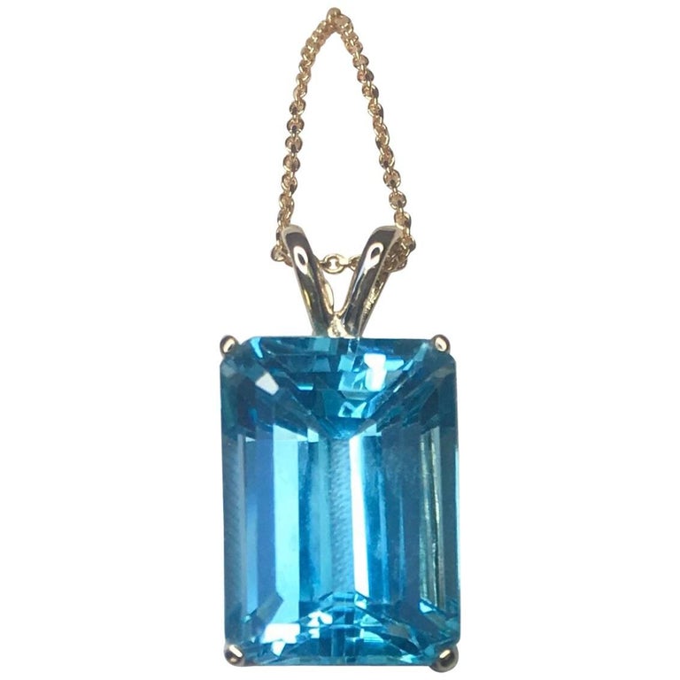 Large Swiss Blue 9.70 Carat Emerald Cut Blue Topaz Gold Pendant